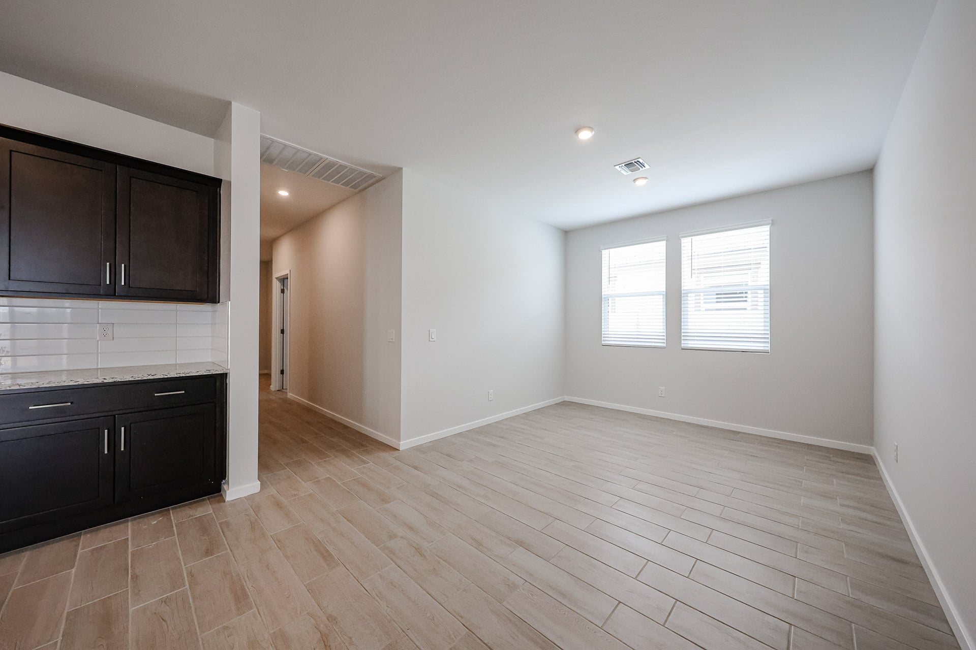 A room with a wood floor and a wood floor.