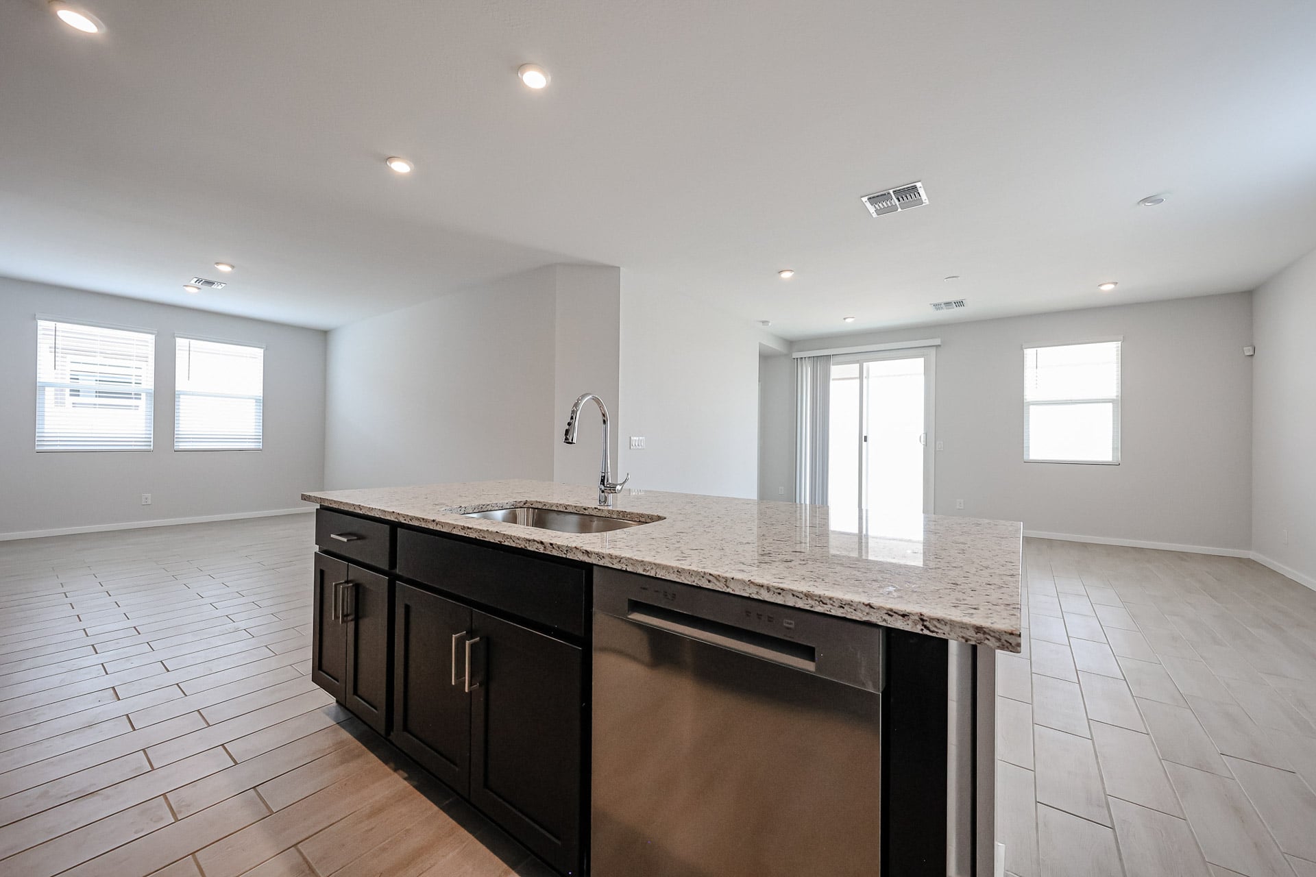 A kitchen with a marble countertop.
