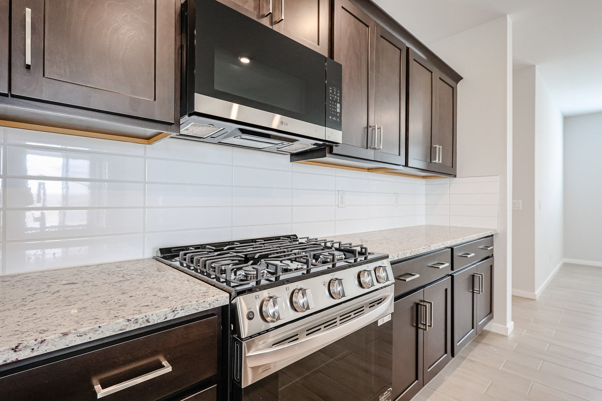 A kitchen with black cabinets.