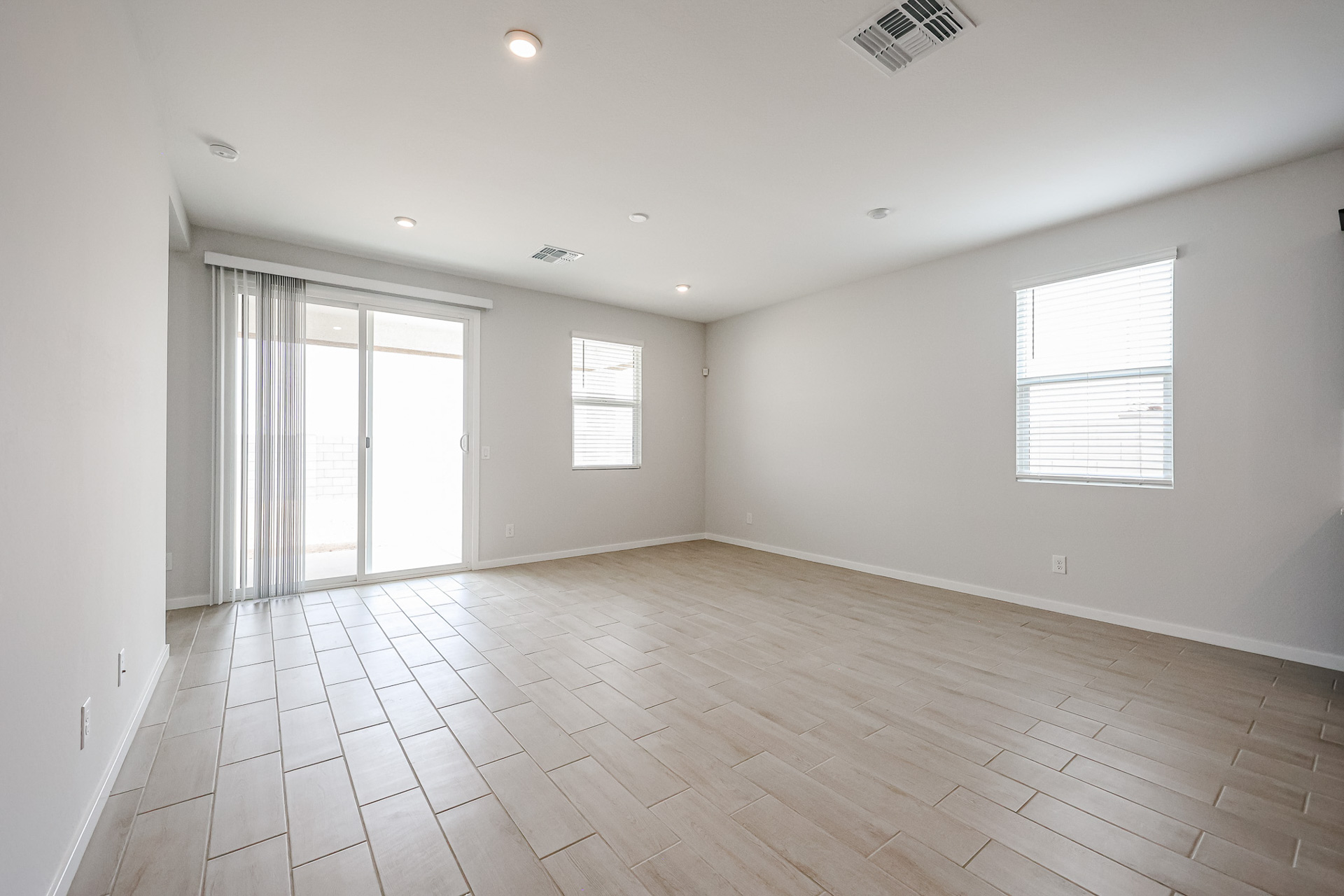 A room with white walls and windows.