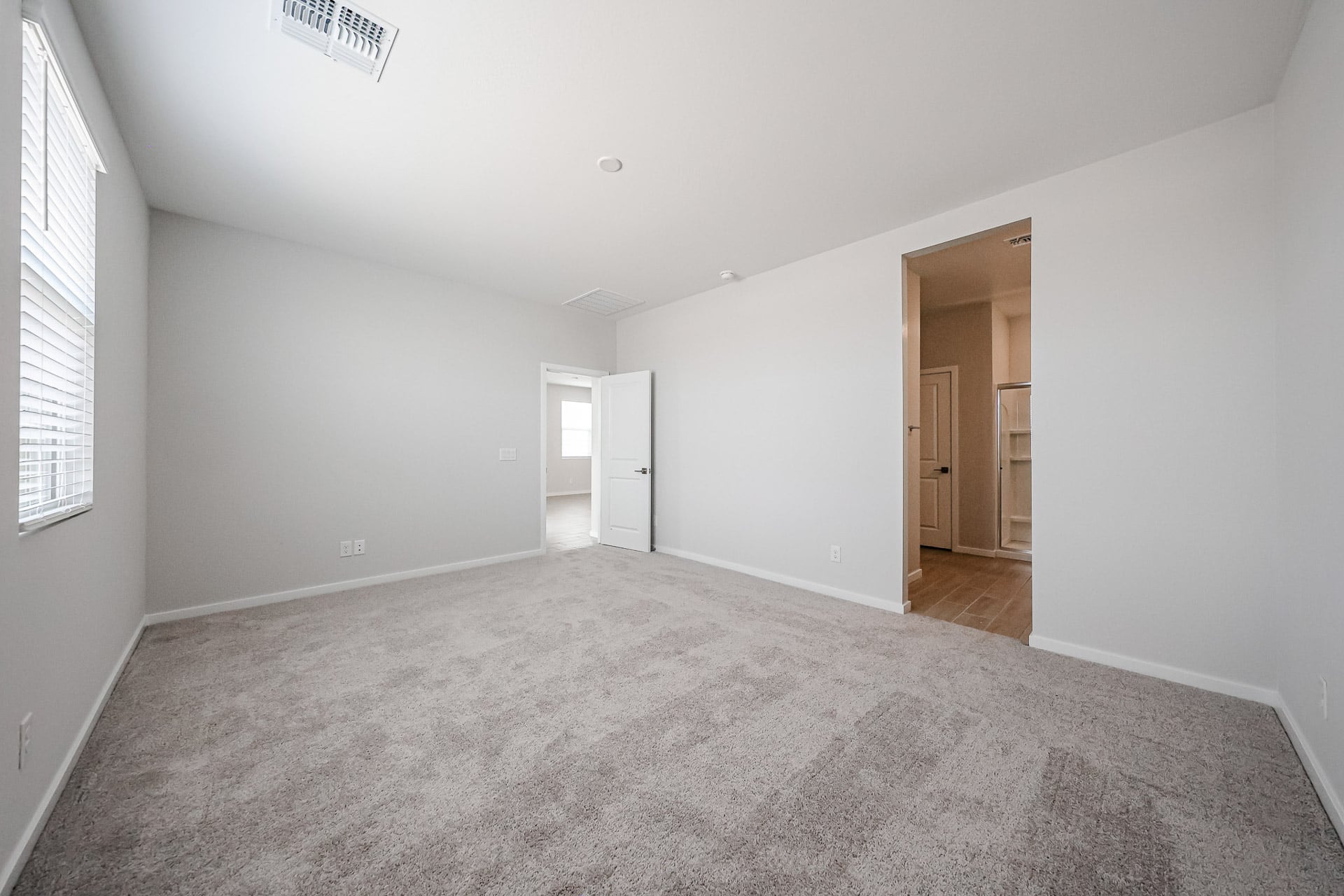 A hallway with white walls.