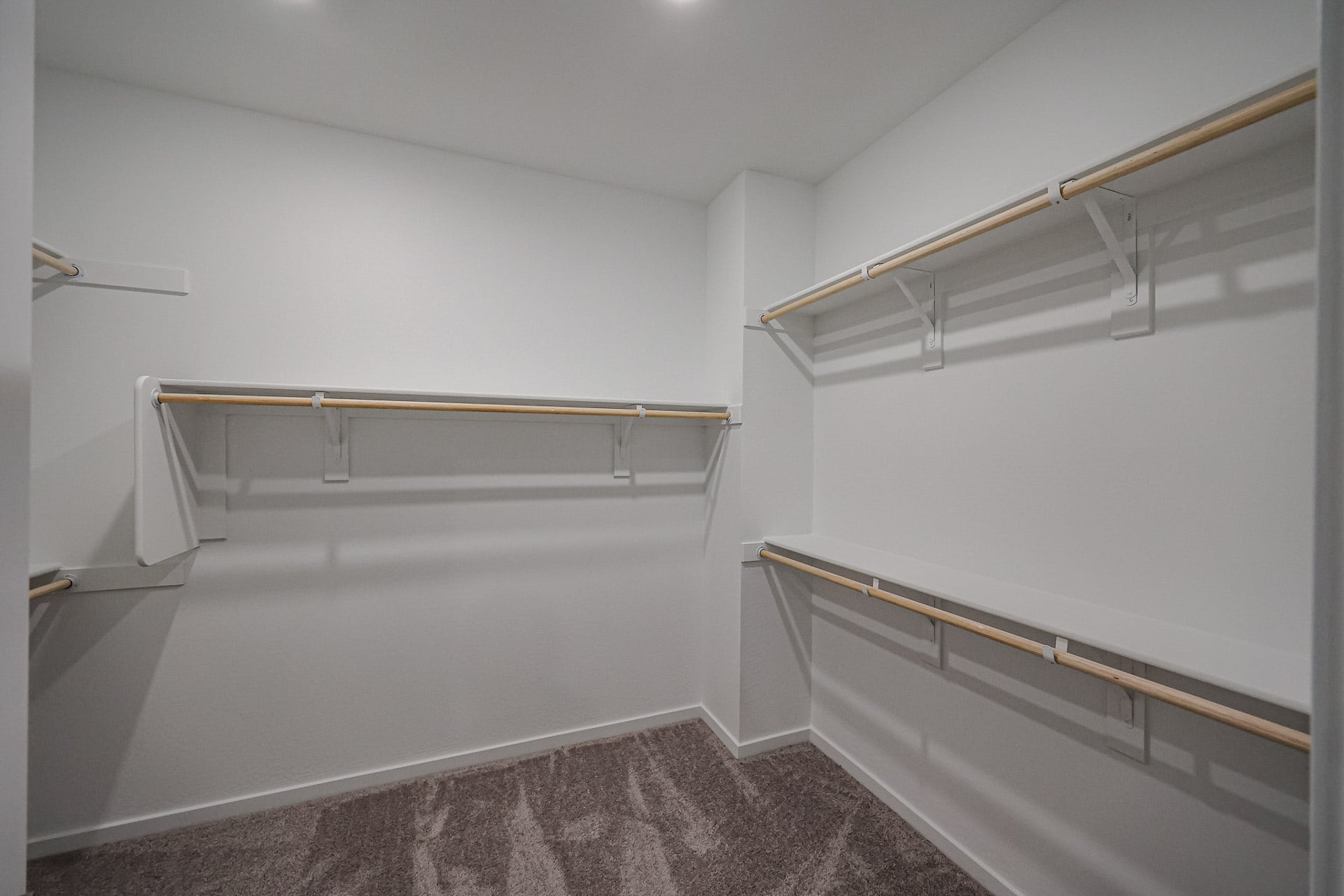 A white room with a staircase.