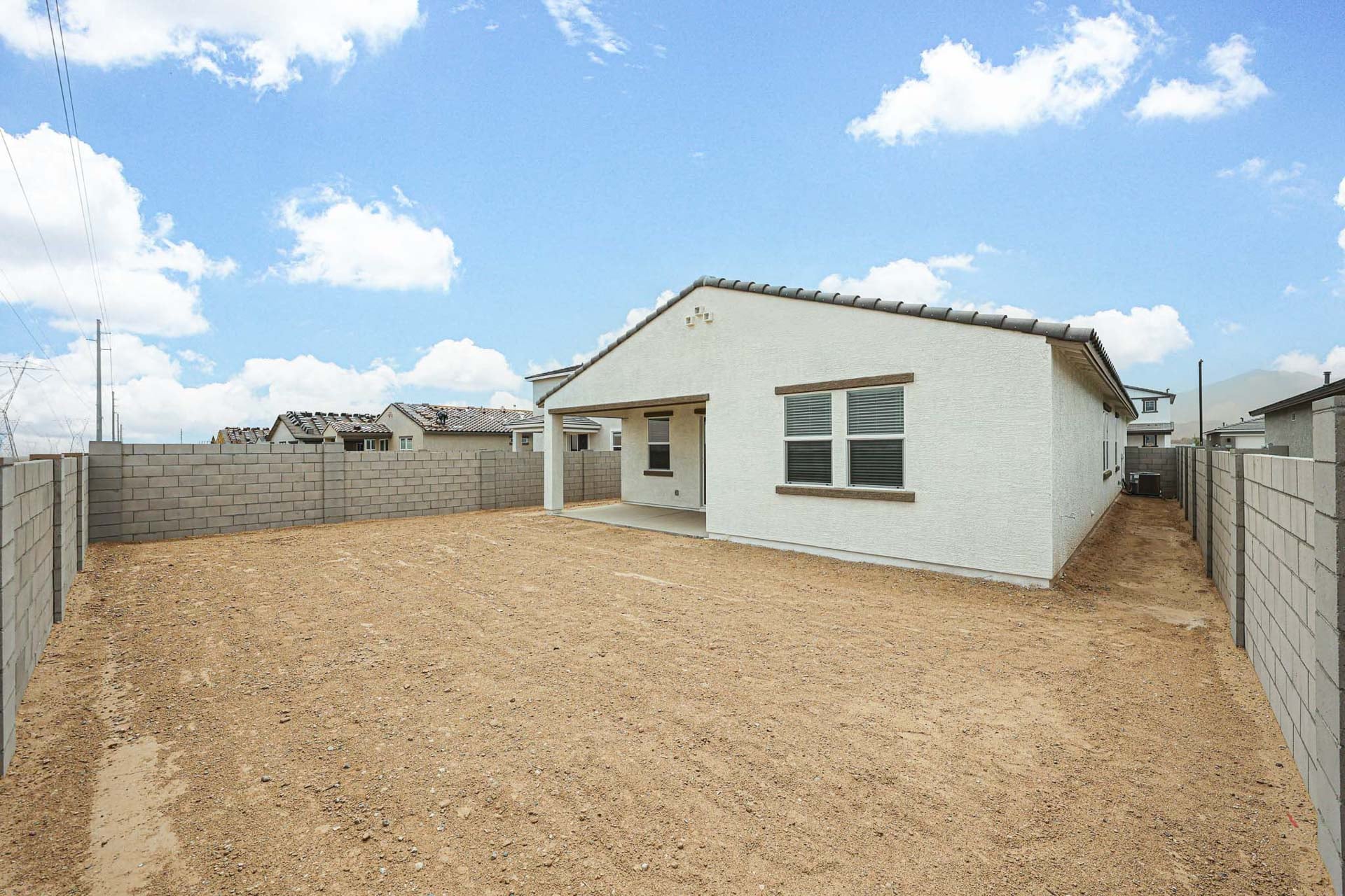 A house with a dirt yard.