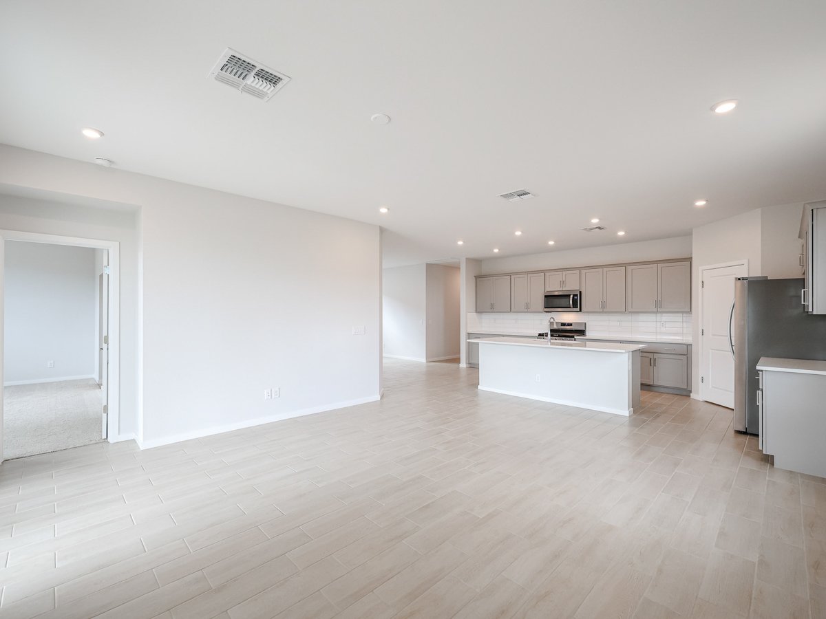 A large kitchen with white cabinets.
