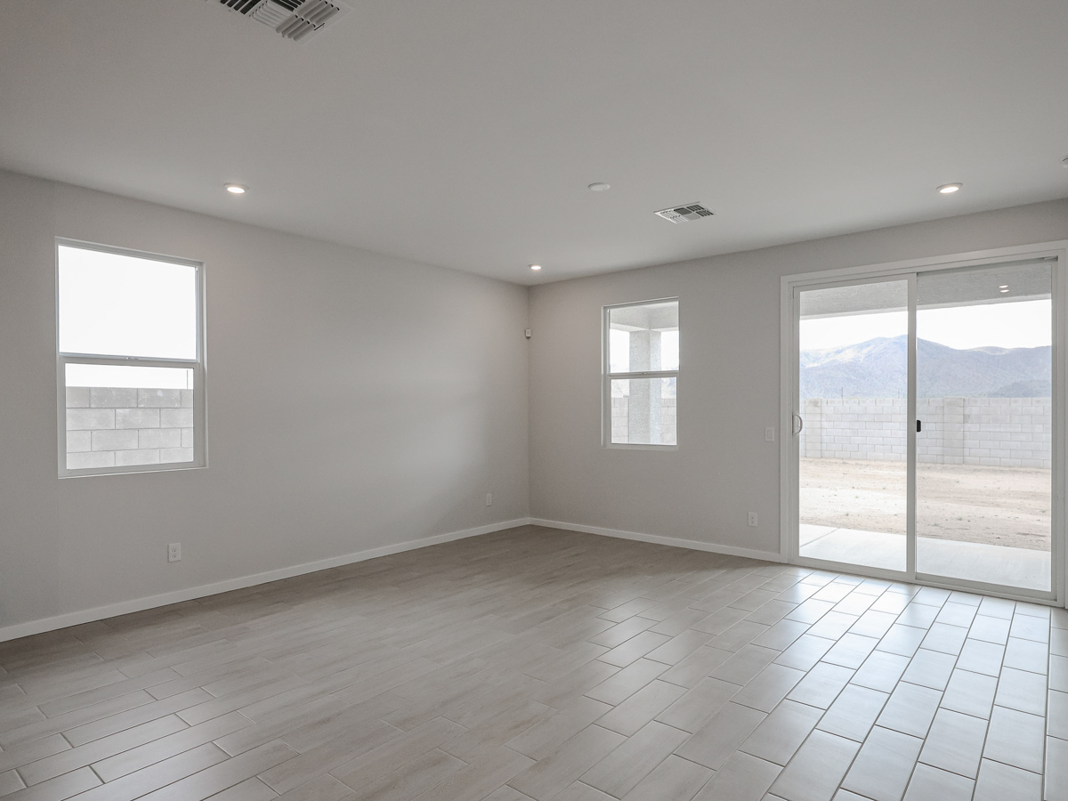 A room with windows and a tile floor.