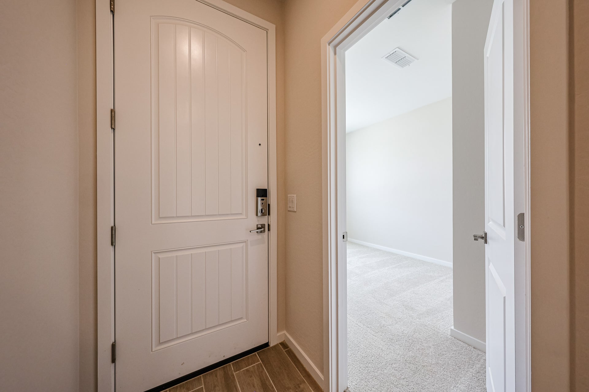 A hallway with white doors.