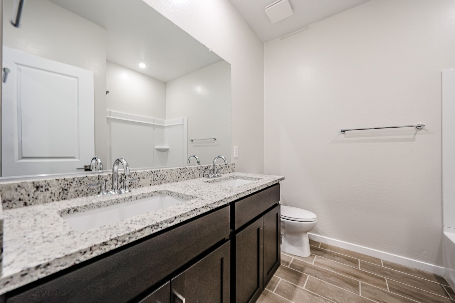 A bathroom with a marble countertop.