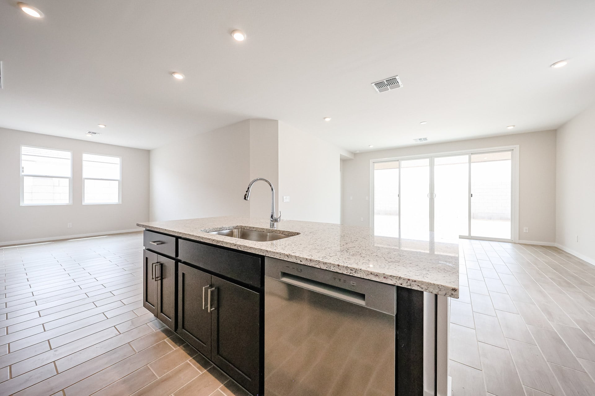 A kitchen with a marble countertop.