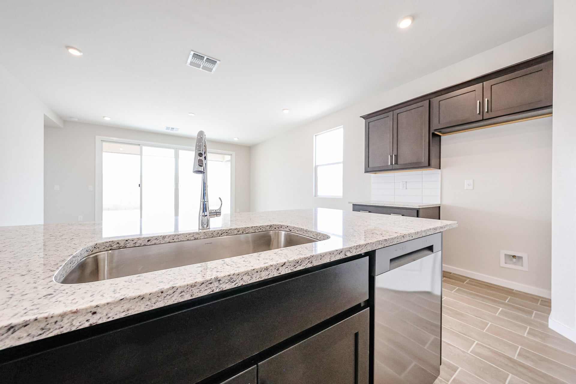 A kitchen with a marble countertop.
