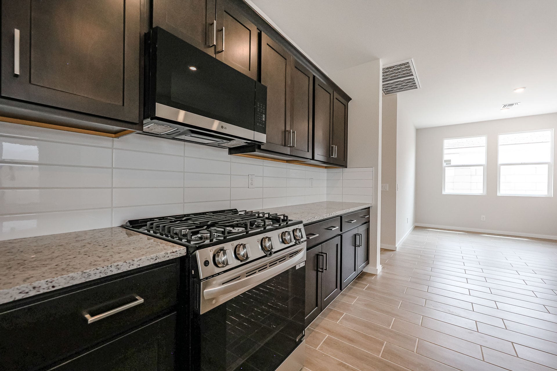 A kitchen with black appliances.