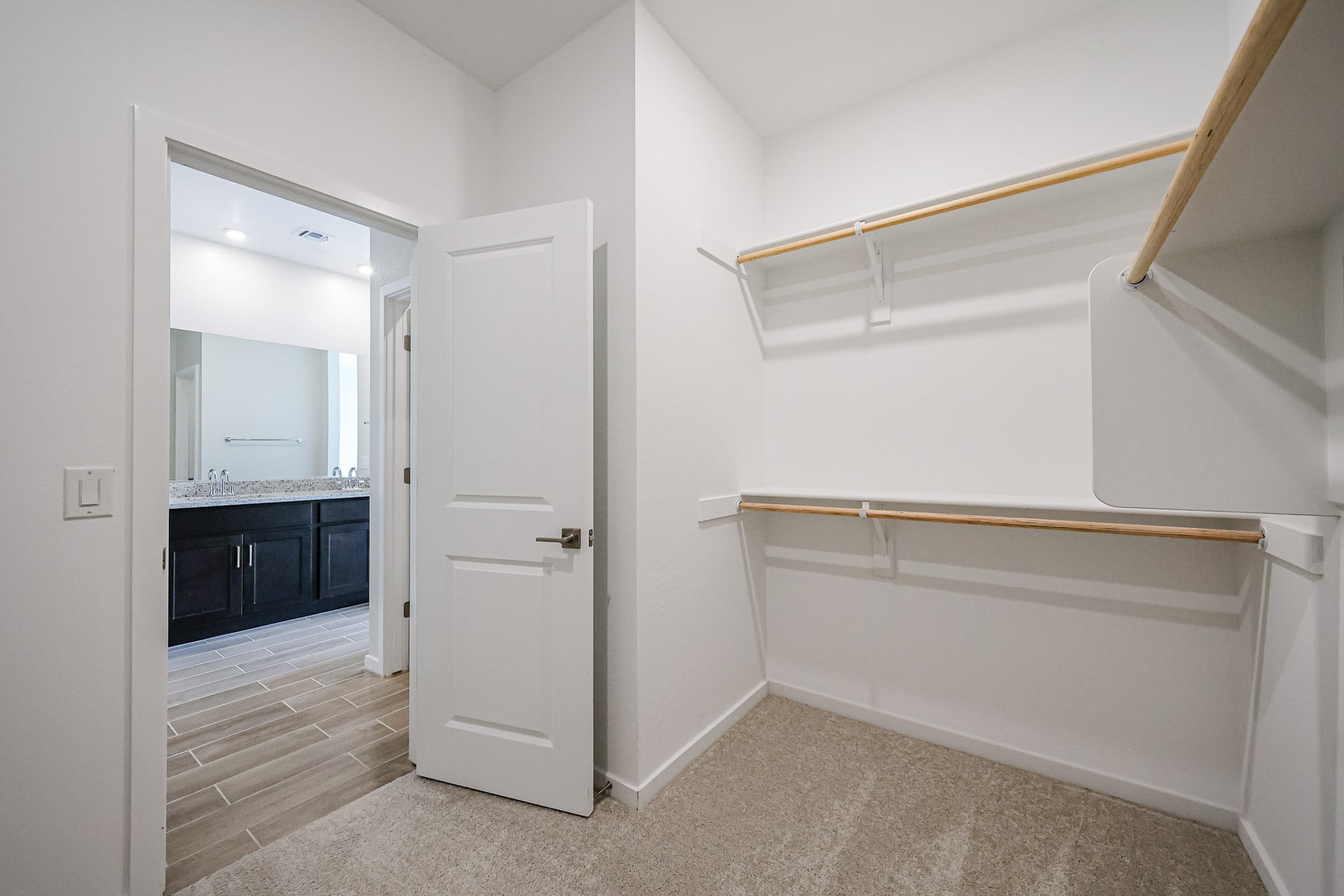 A white room with a white door.