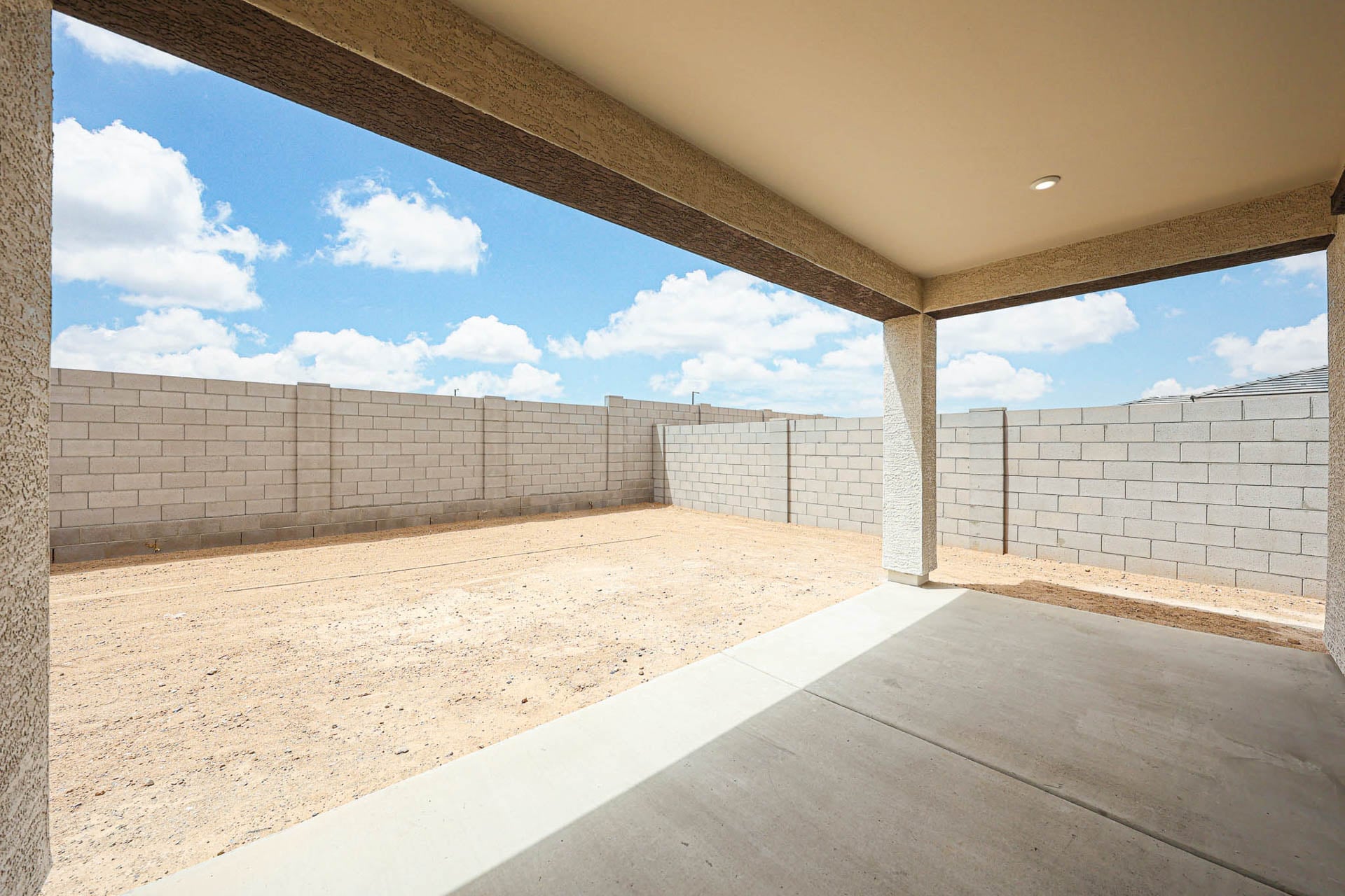 A concrete wall with a concrete floor.