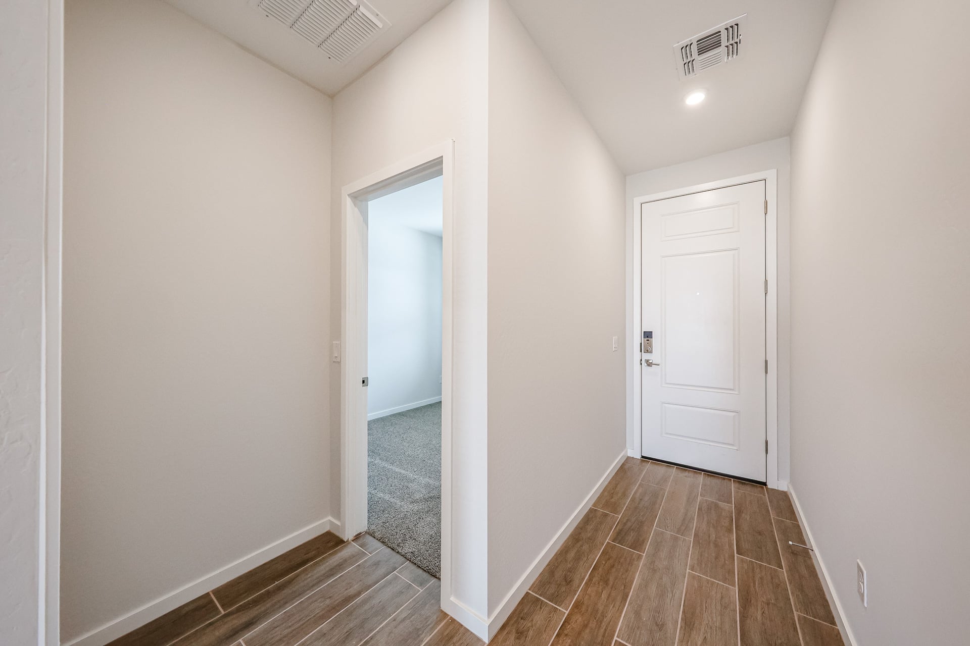 A hallway with white doors.