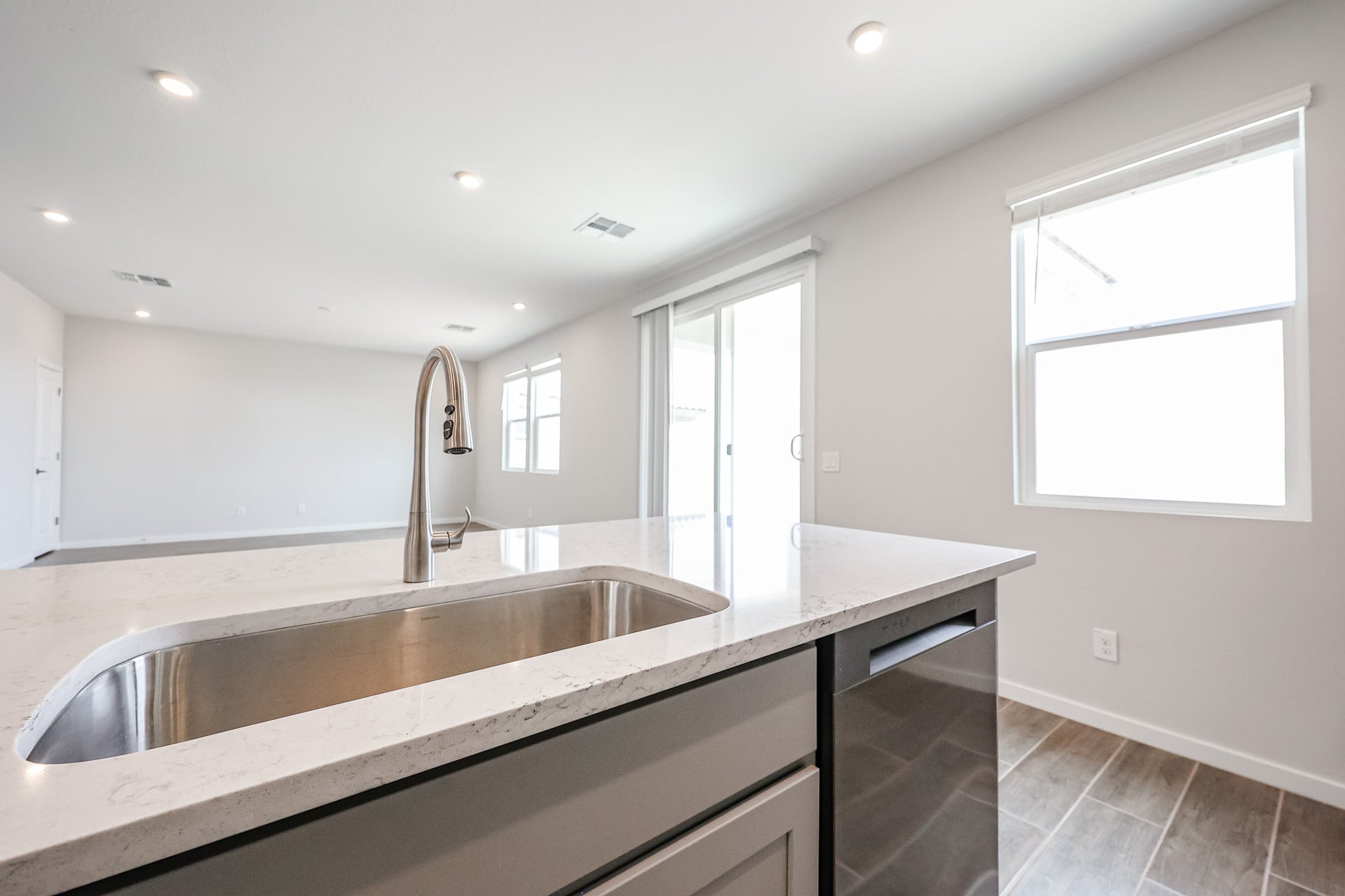 A kitchen with a marble countertop.