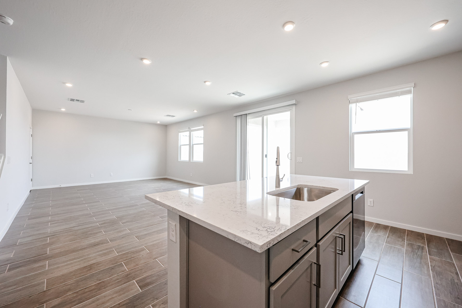 A kitchen with a marble countertop.
