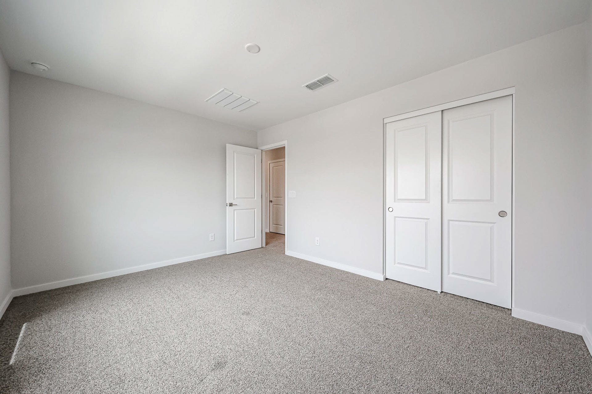 A room with white doors.
