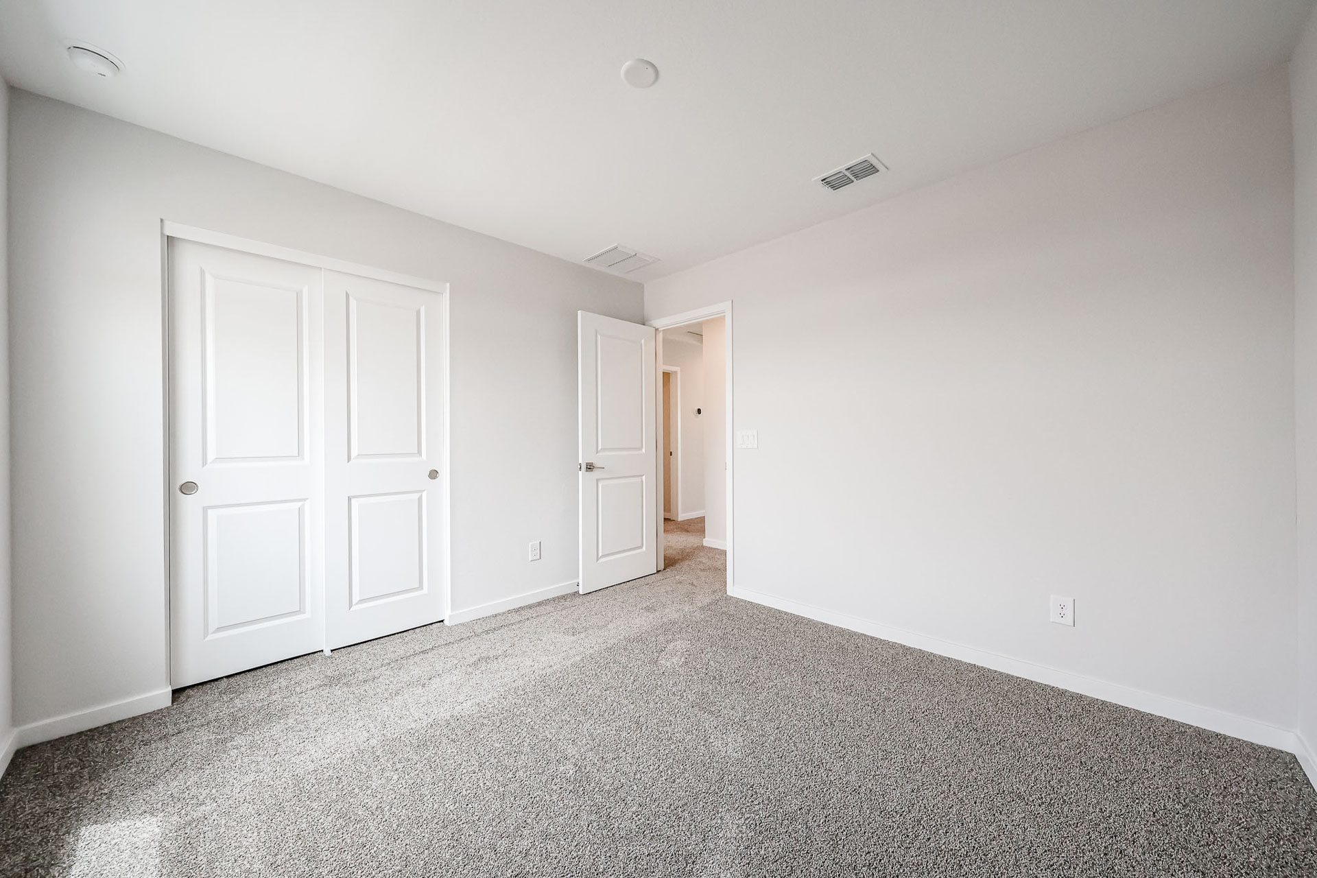 A room with white doors.