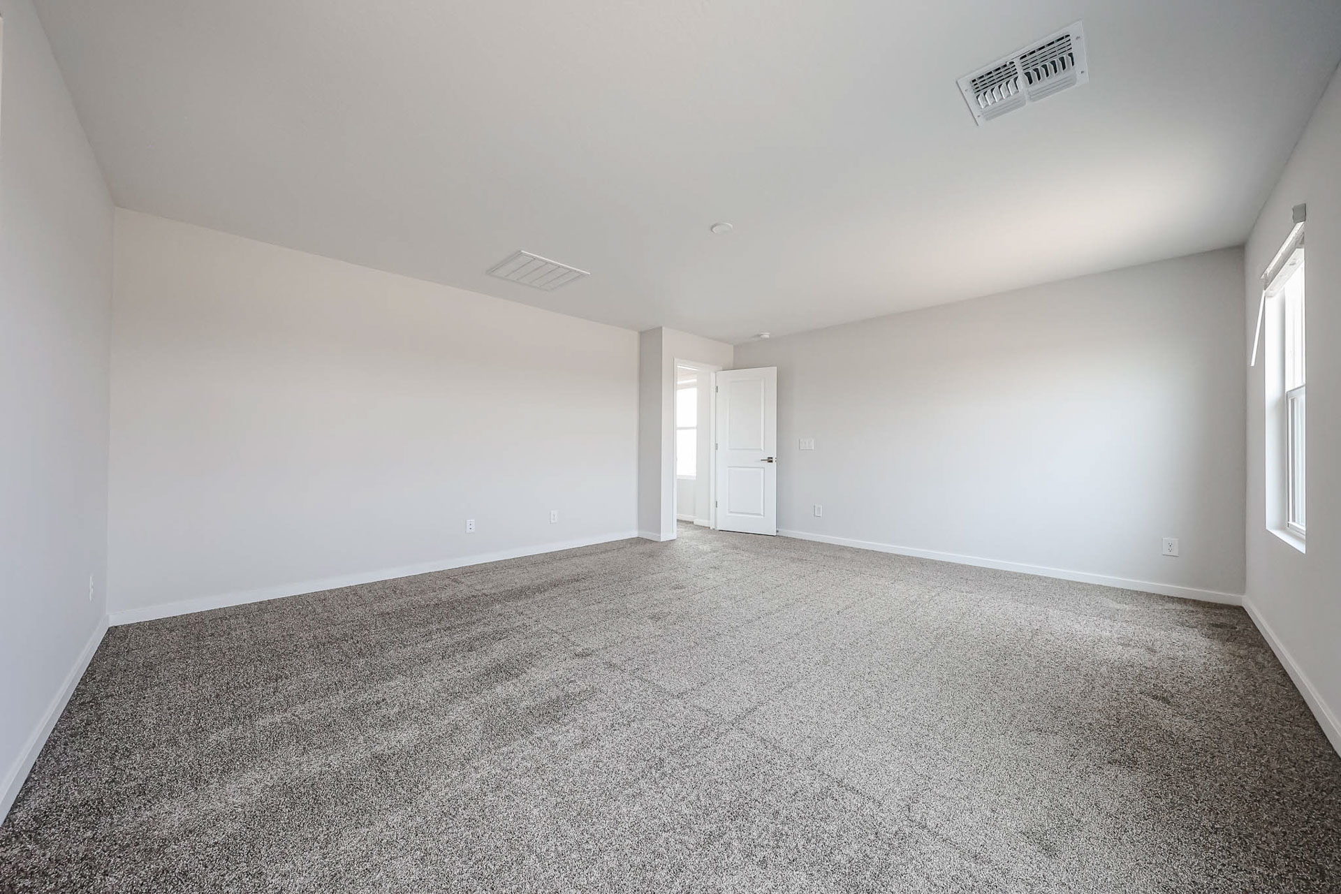 A hallway with white doors.