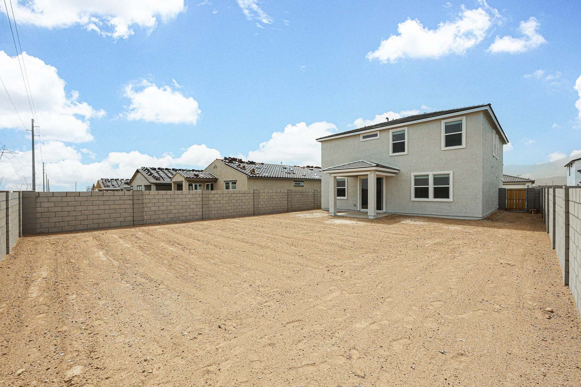 A house in a dirt field.