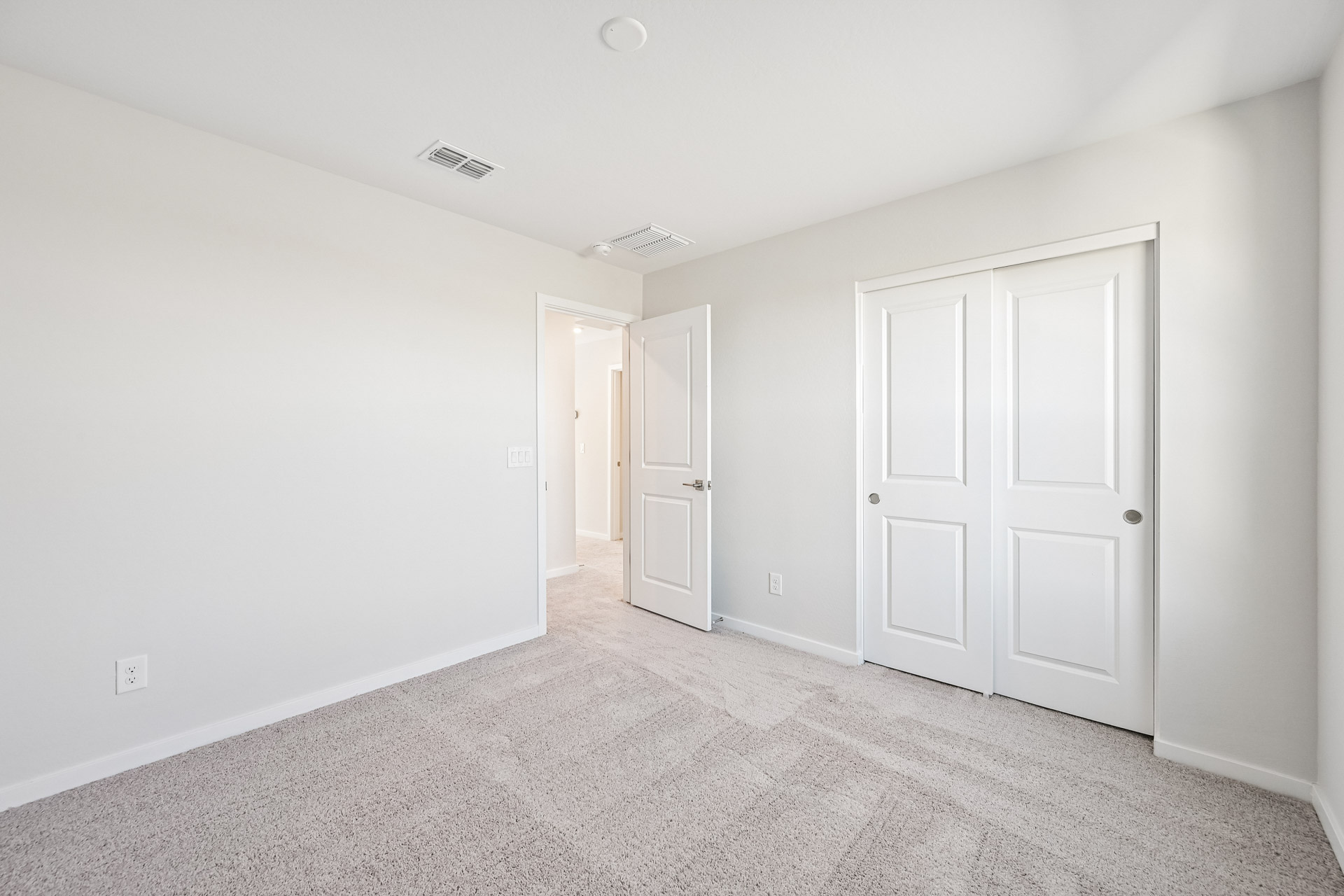 A room with white doors.