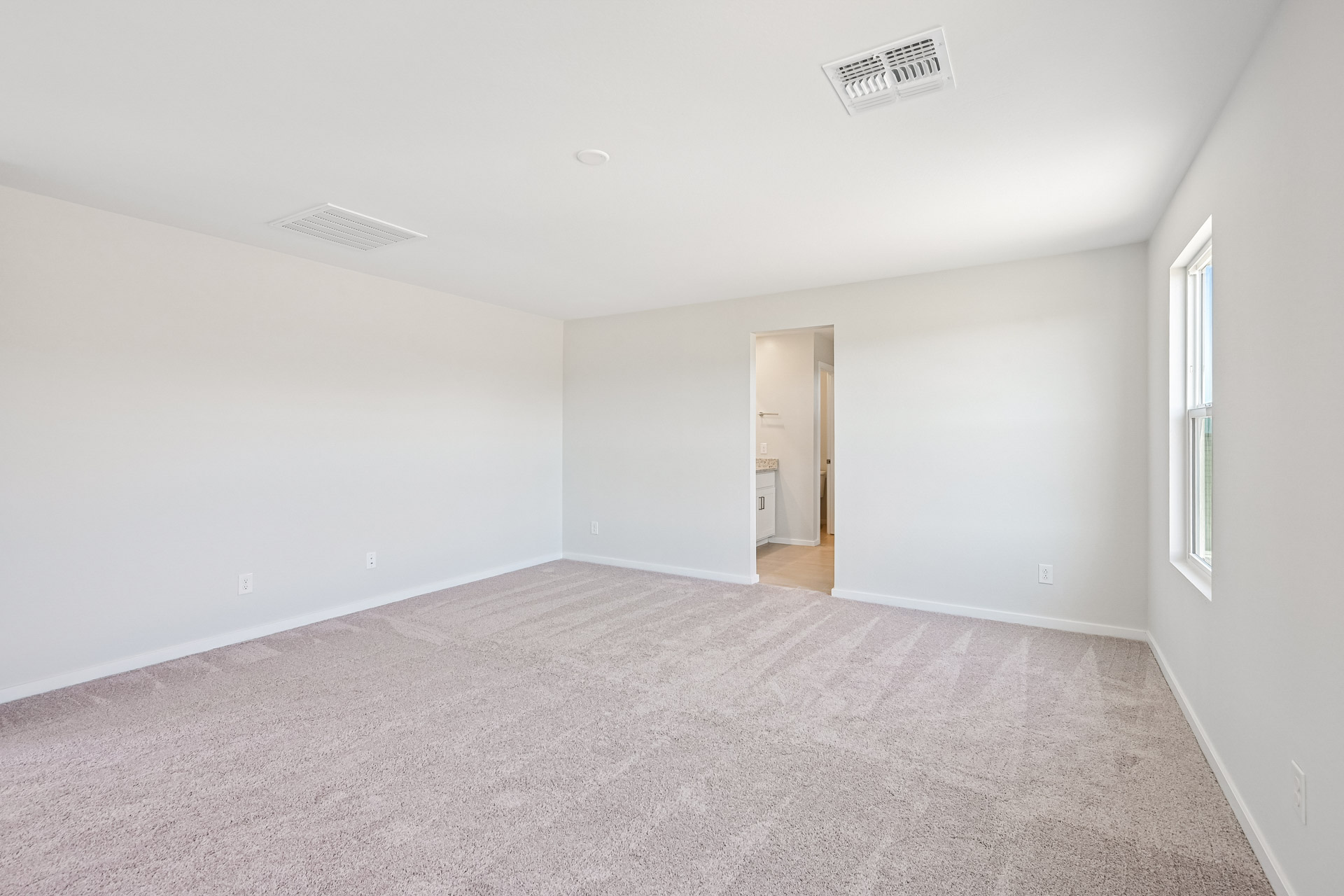 A hallway with carpet.