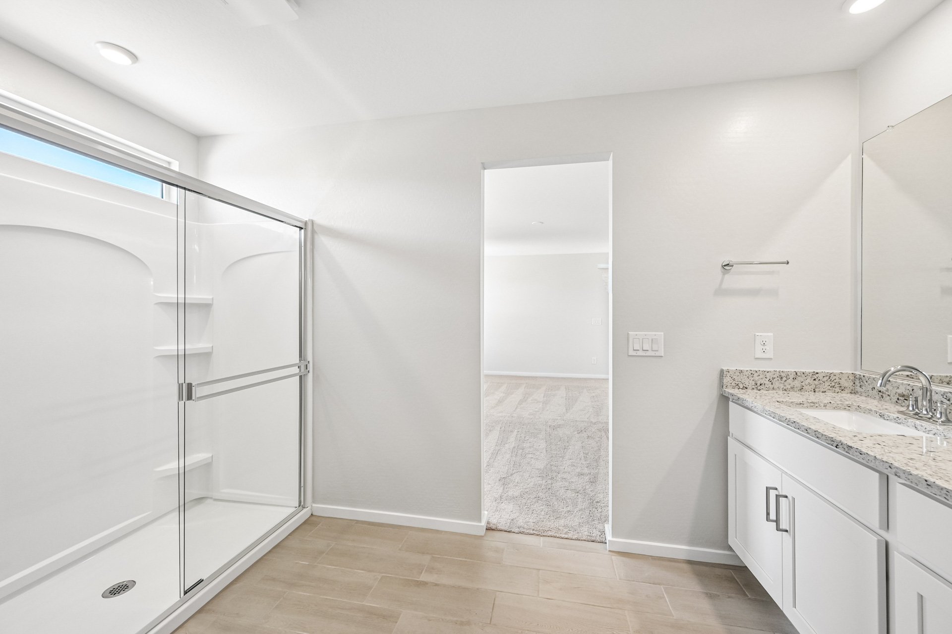 A bathroom with a glass shower.