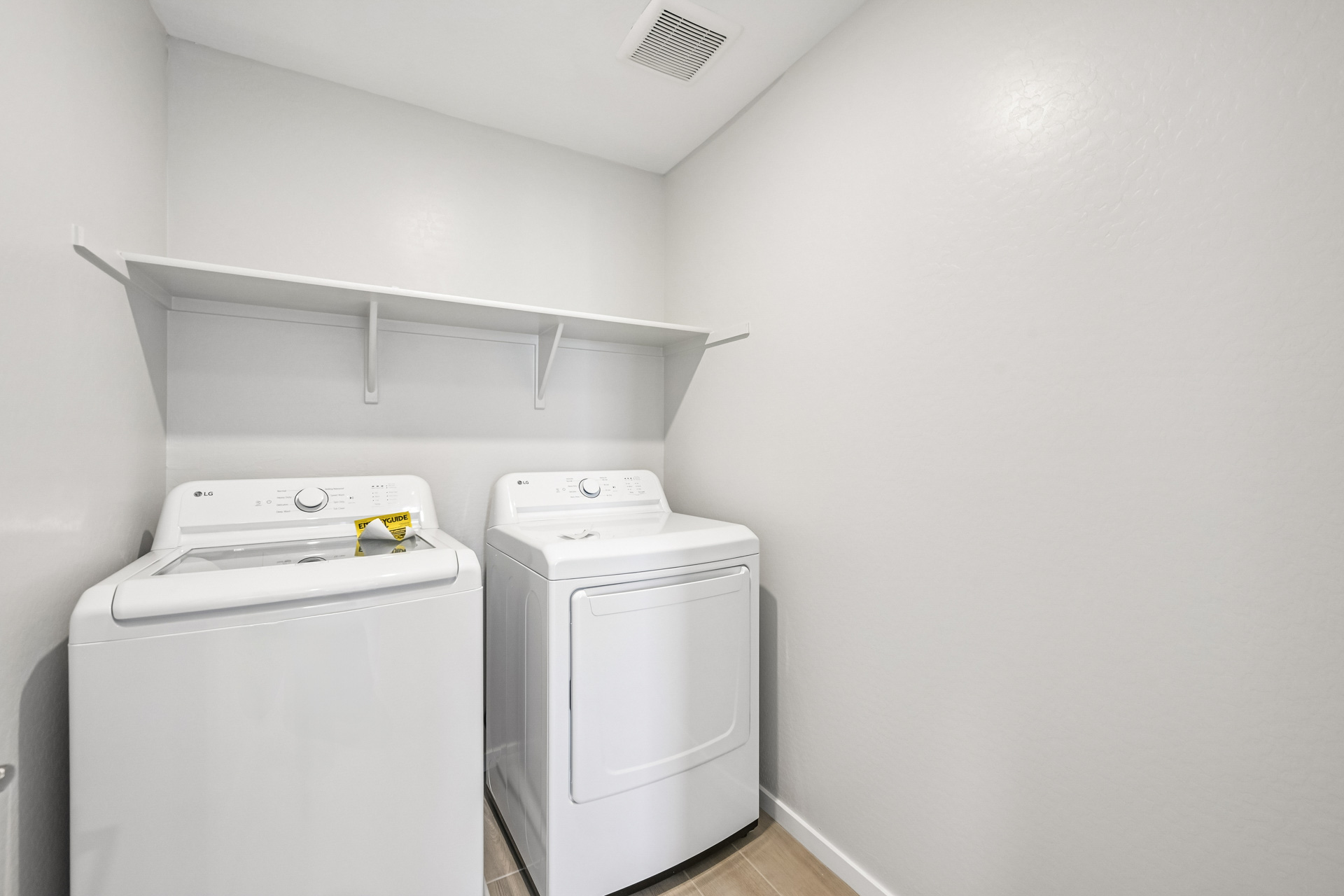 A washing machine in a room.