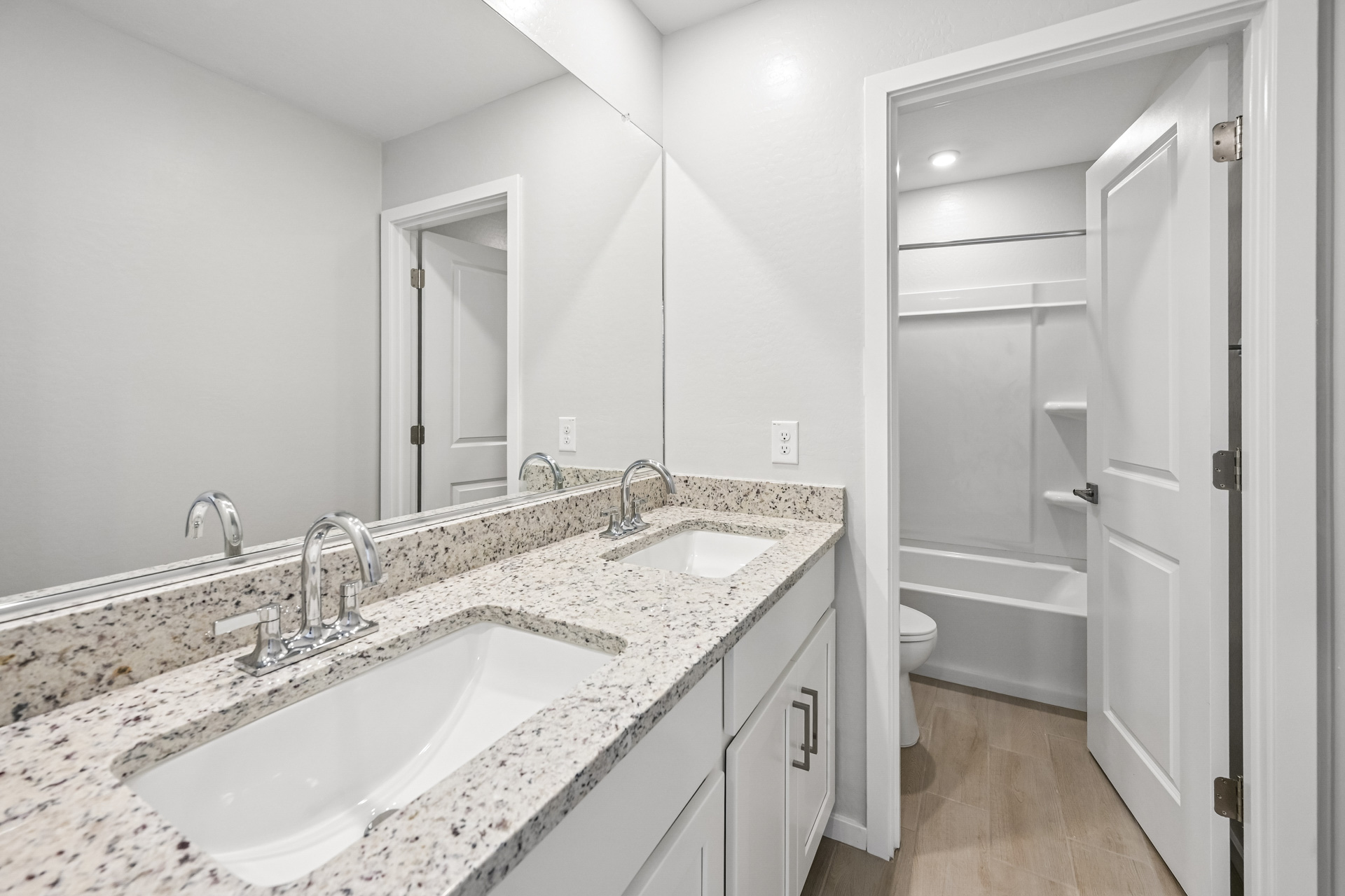 A bathroom with a sink and a toilet.