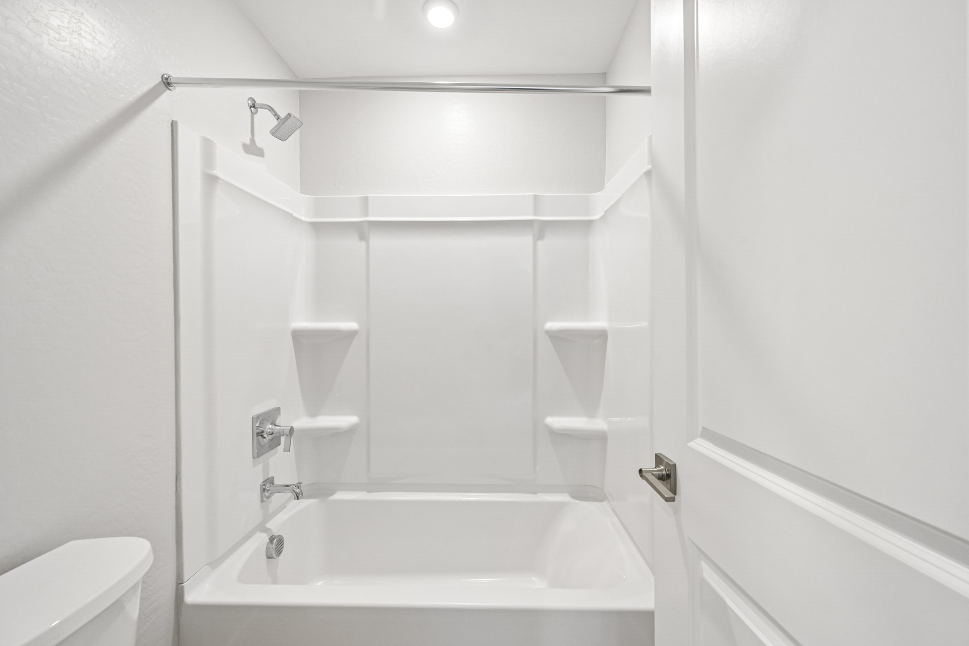 A bathroom with a tub and sink.