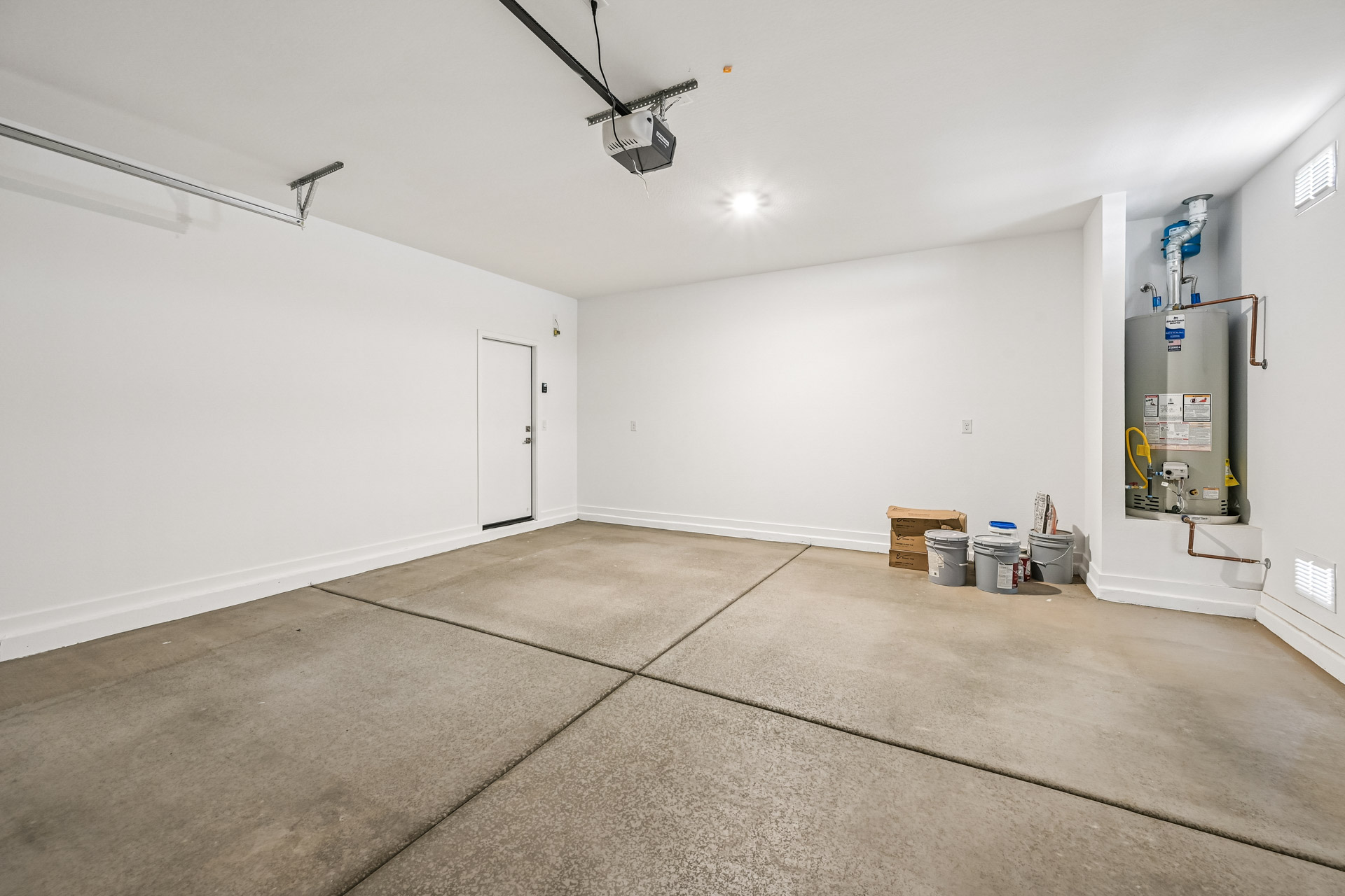 A room with white walls and a tile floor.