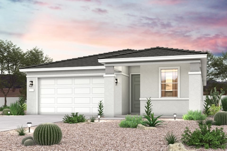 A house with a gravel driveway.