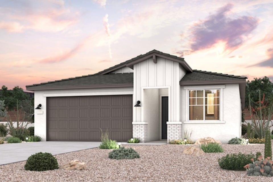 A house with a gravel driveway.