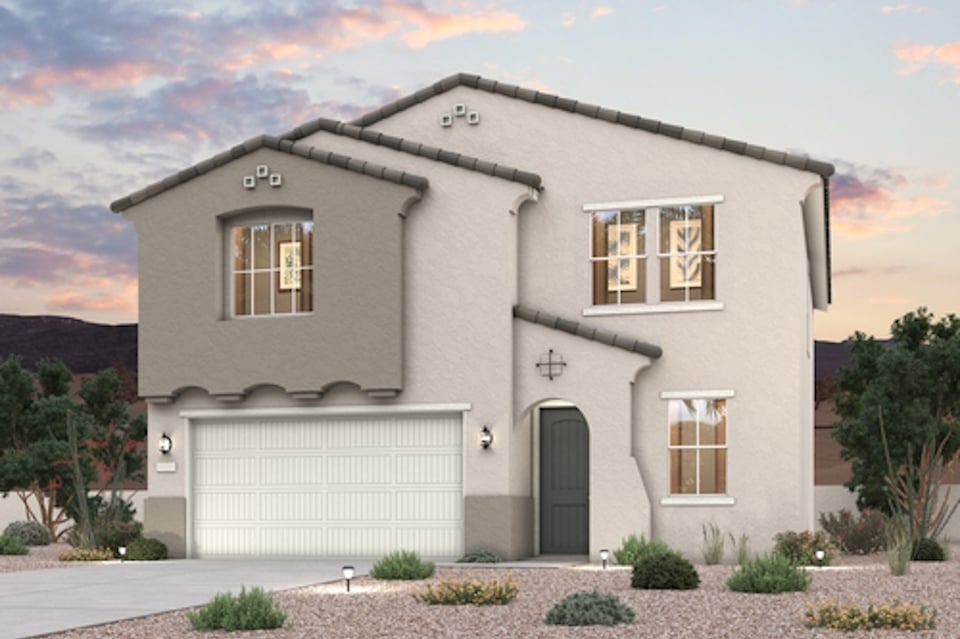 A white house with a garage.