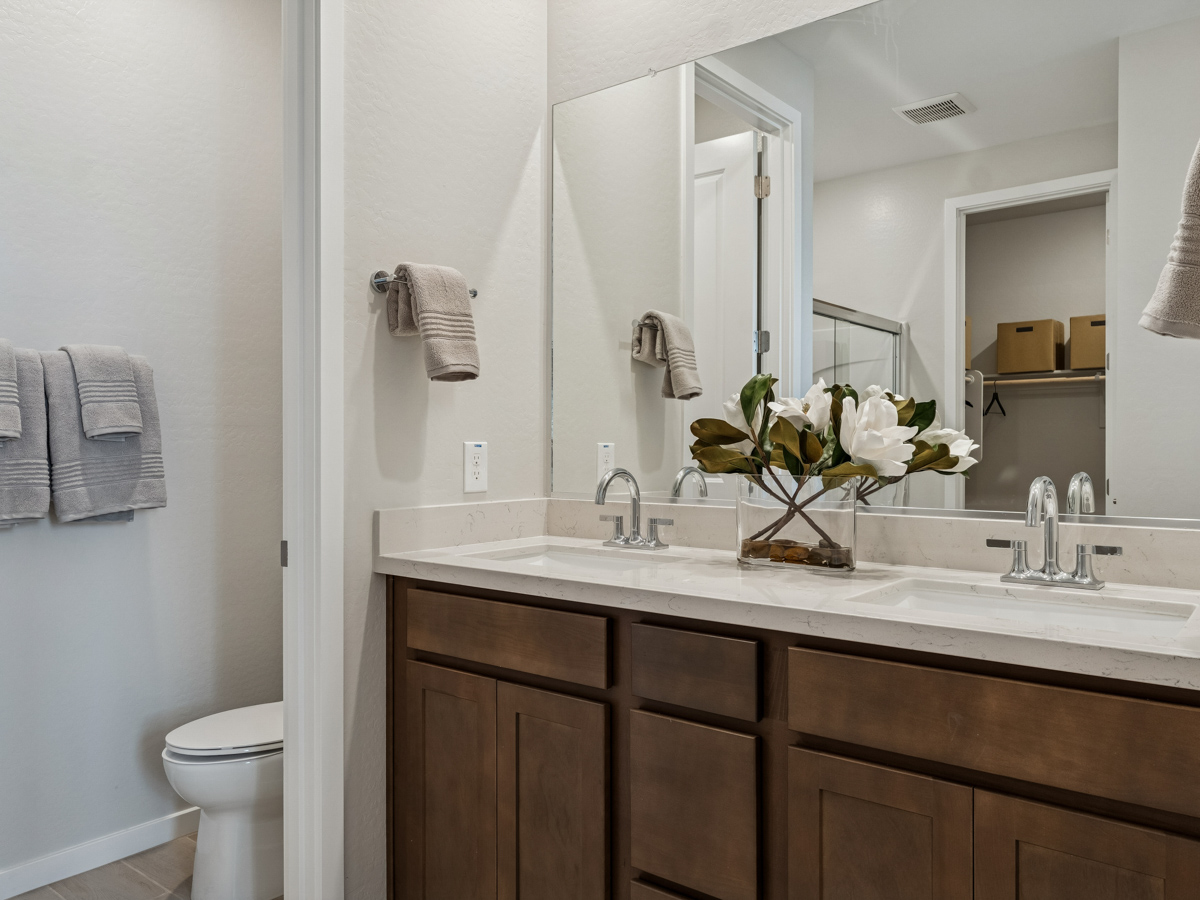 A bathroom with a large mirror.