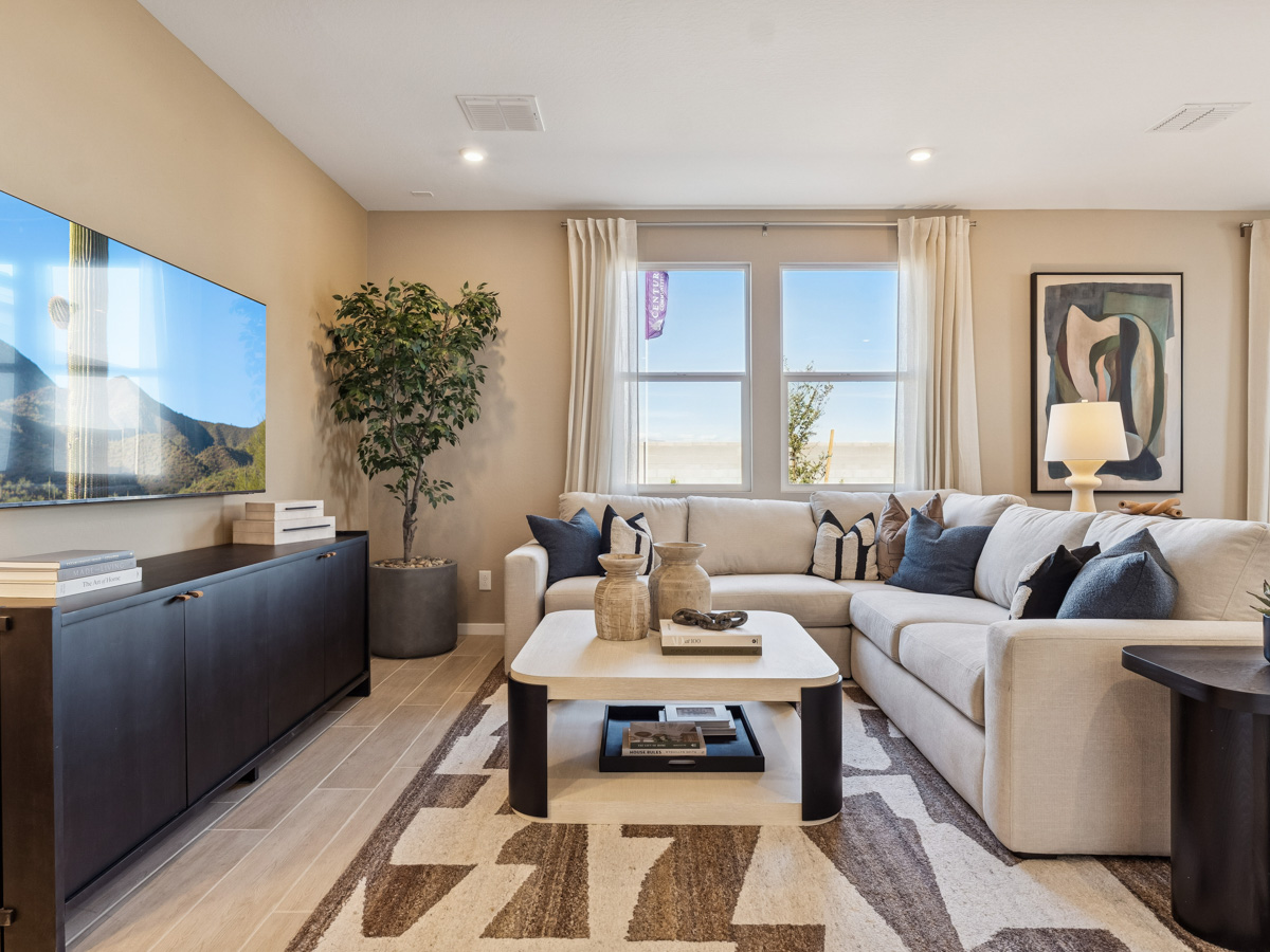 A living room with a couch and a coffee table.