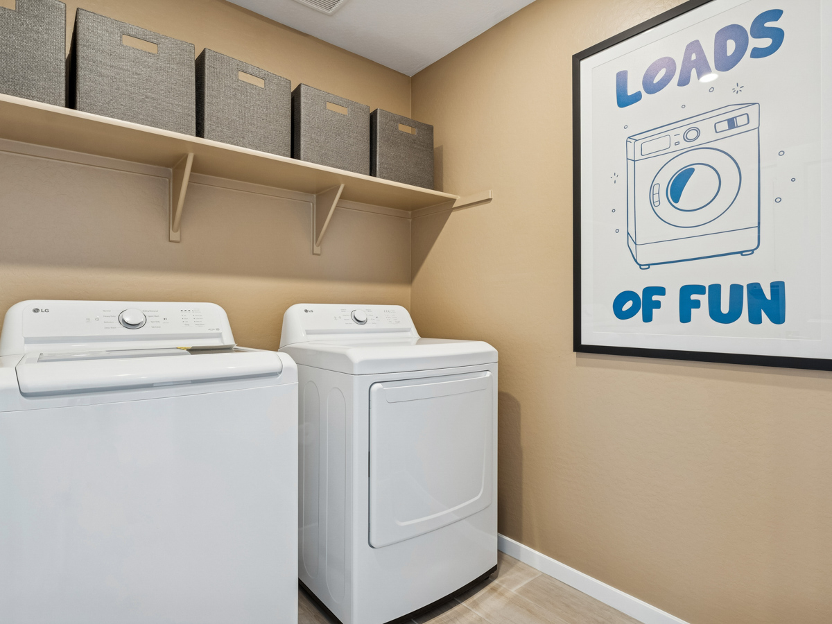 A washer and dryer in a room.