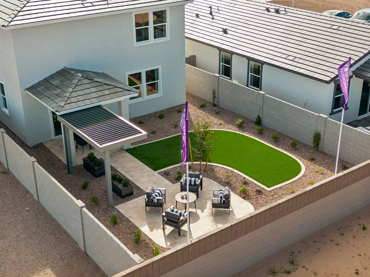 A building with a lawn and cars.