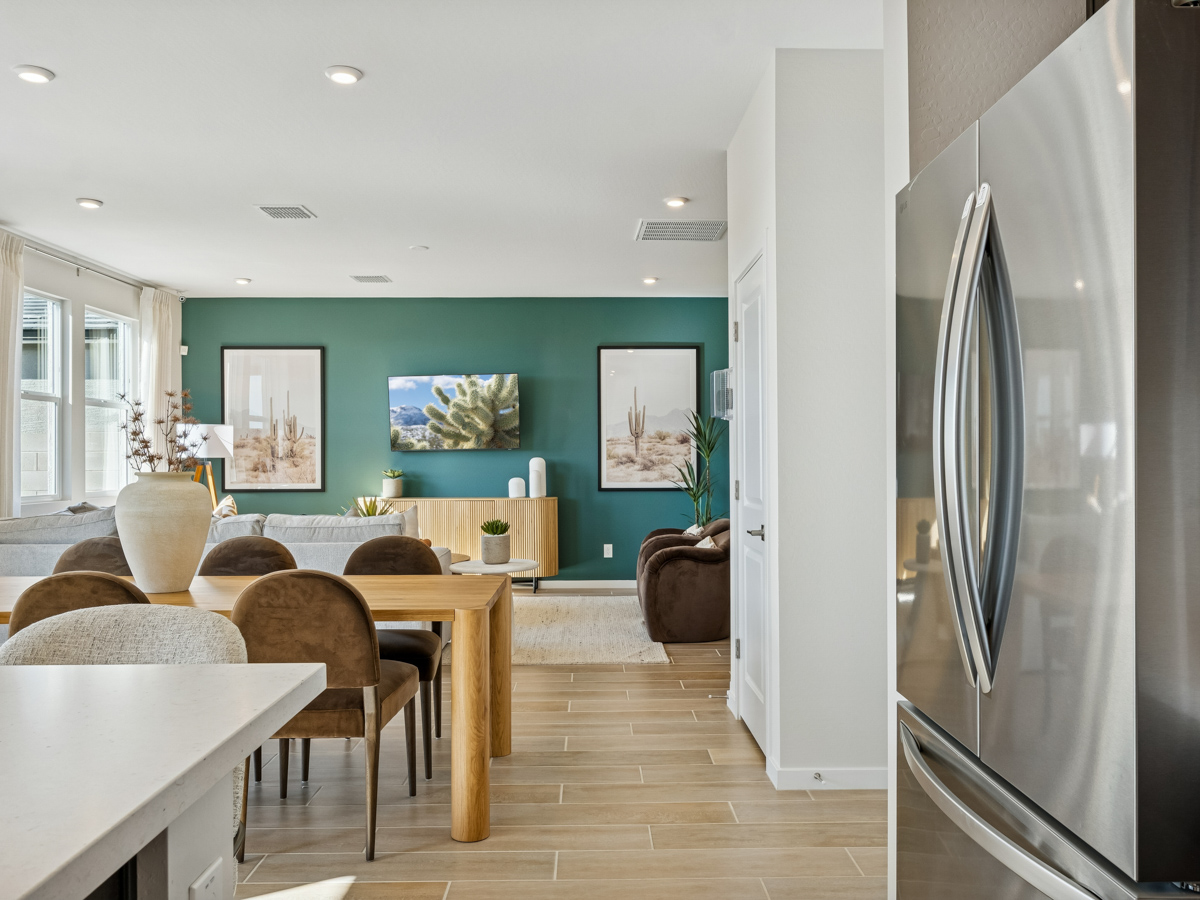 A living room with a green wall.
