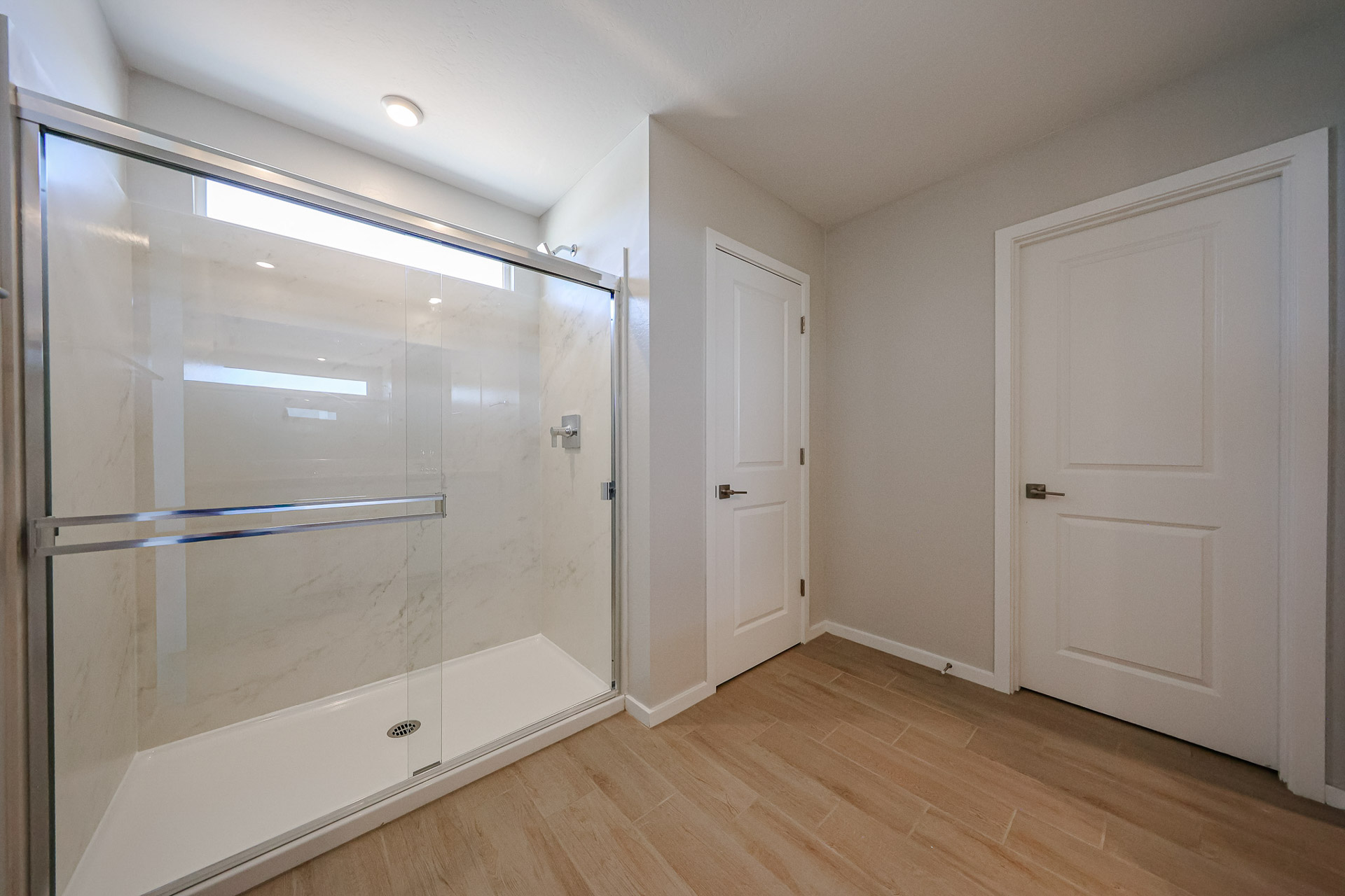 A room with white doors.