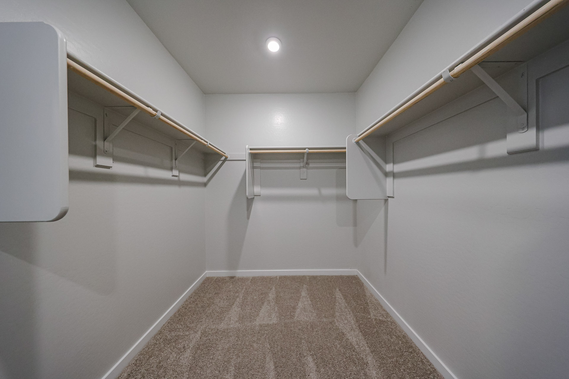 A hallway with white walls.