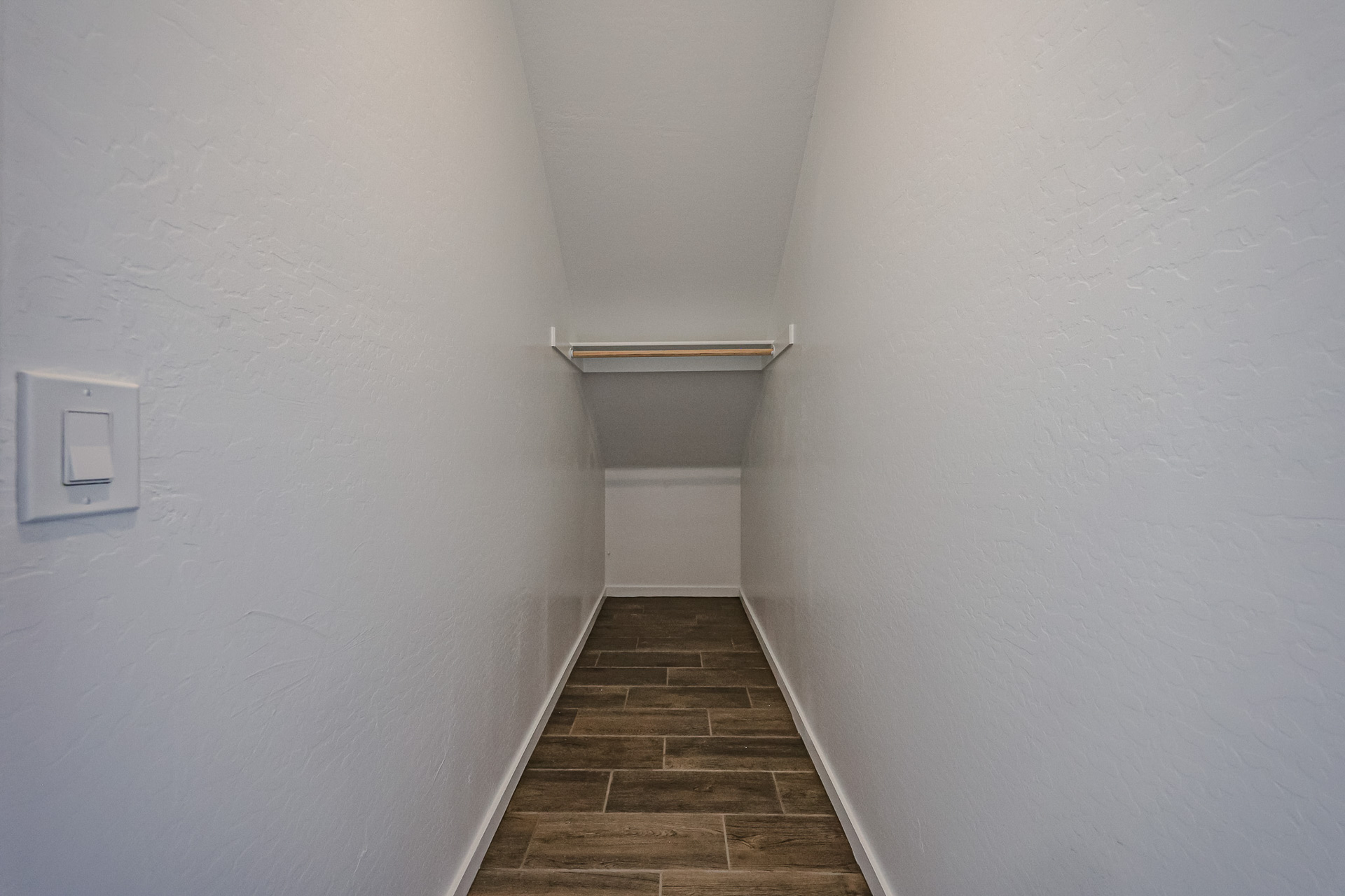 A hallway with white walls.