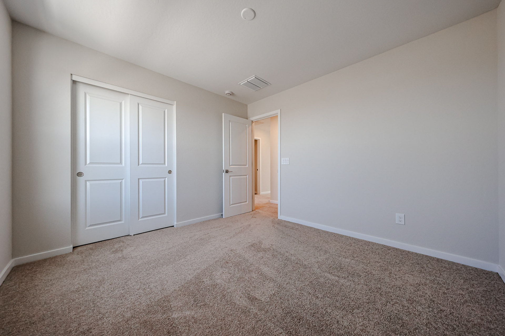 A room with white doors.
