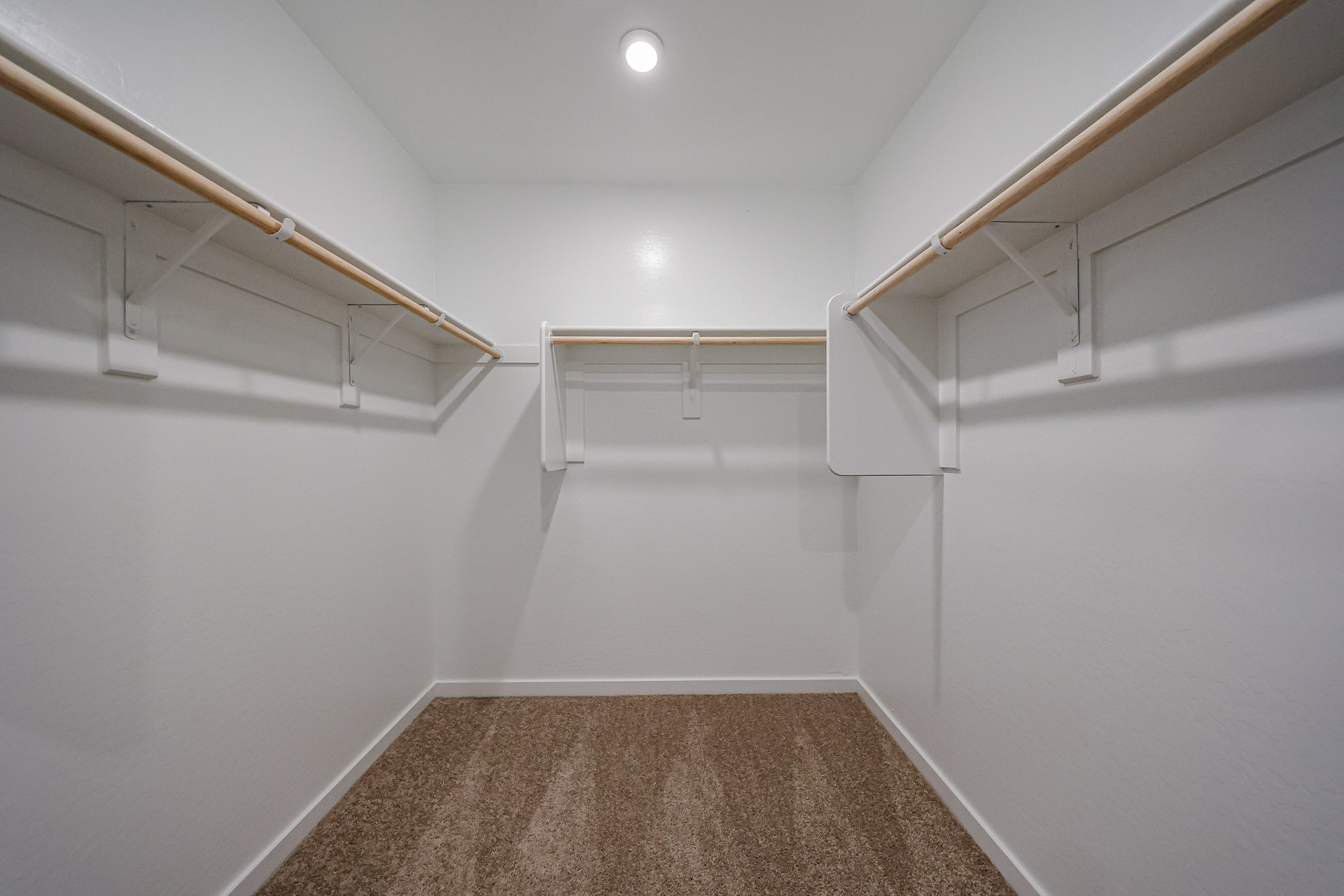 A hallway with white walls.