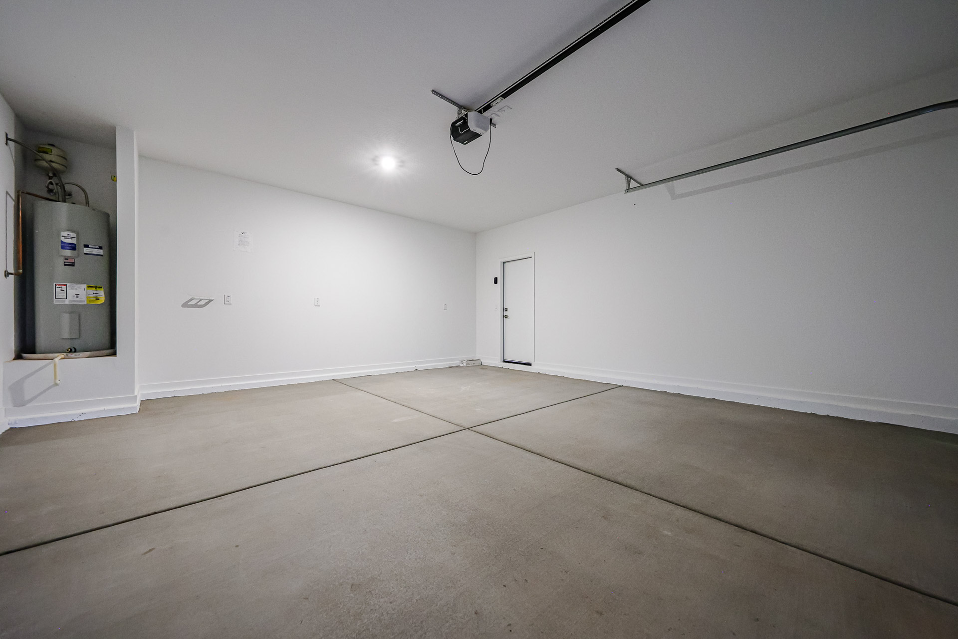 A room with a wood floor and white walls.