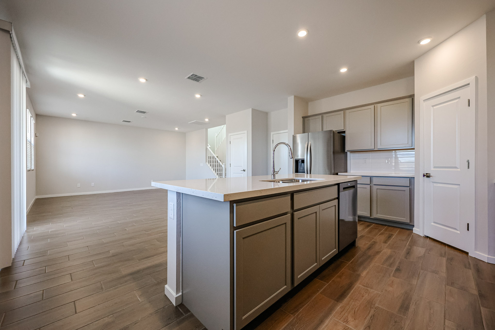 A kitchen with wooden floors.