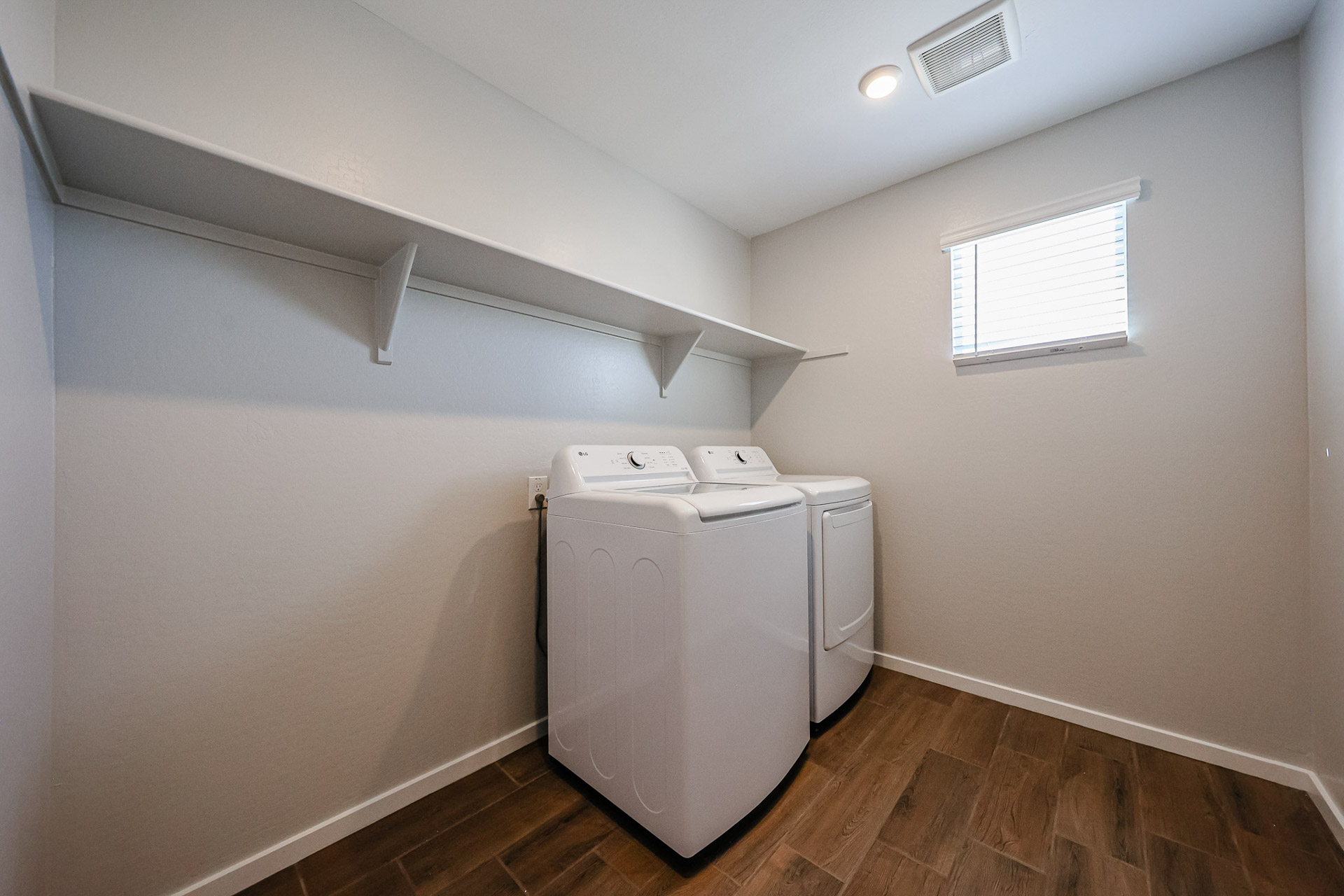 A white washing machine in a room.