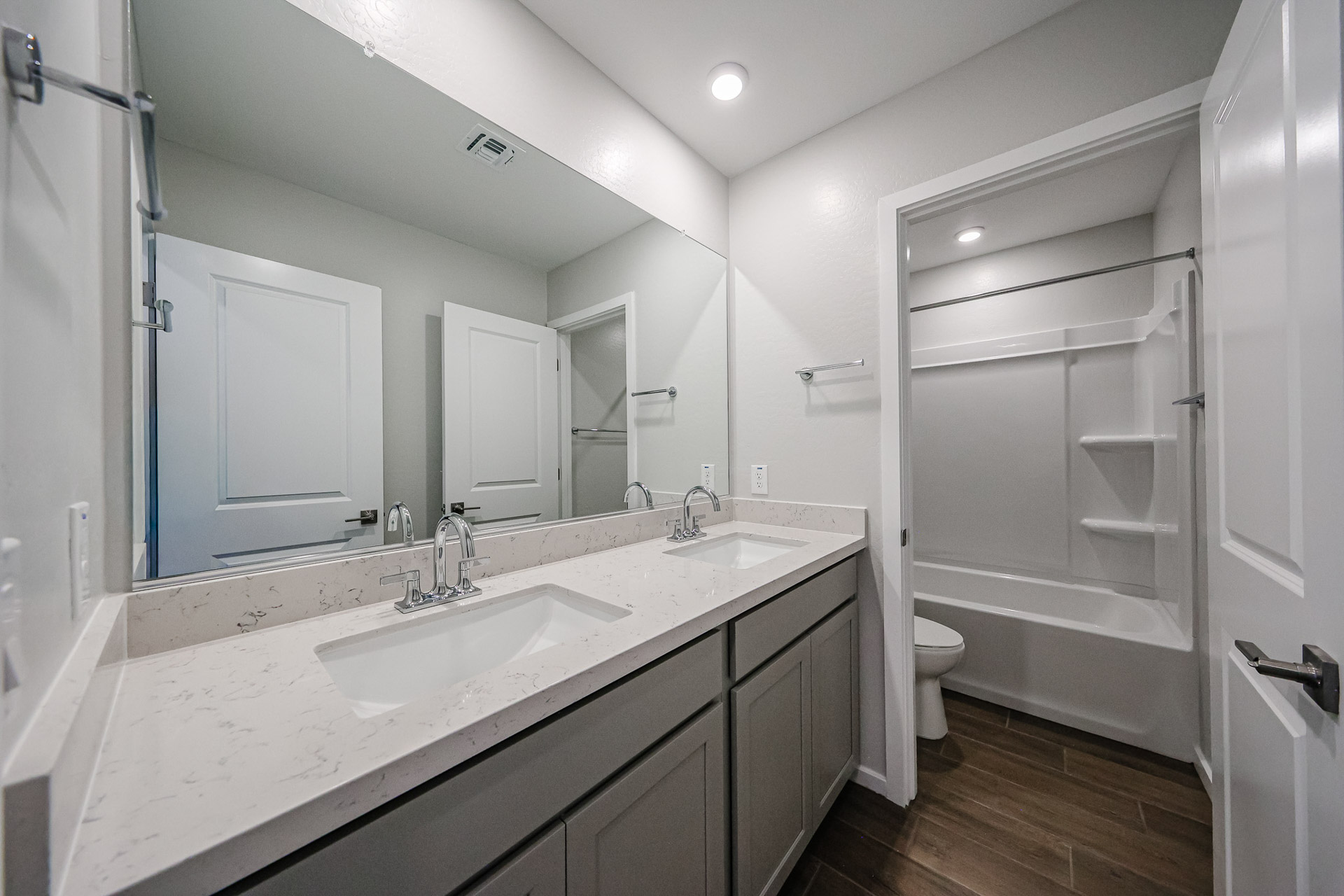 A bathroom with a sink and a toilet.