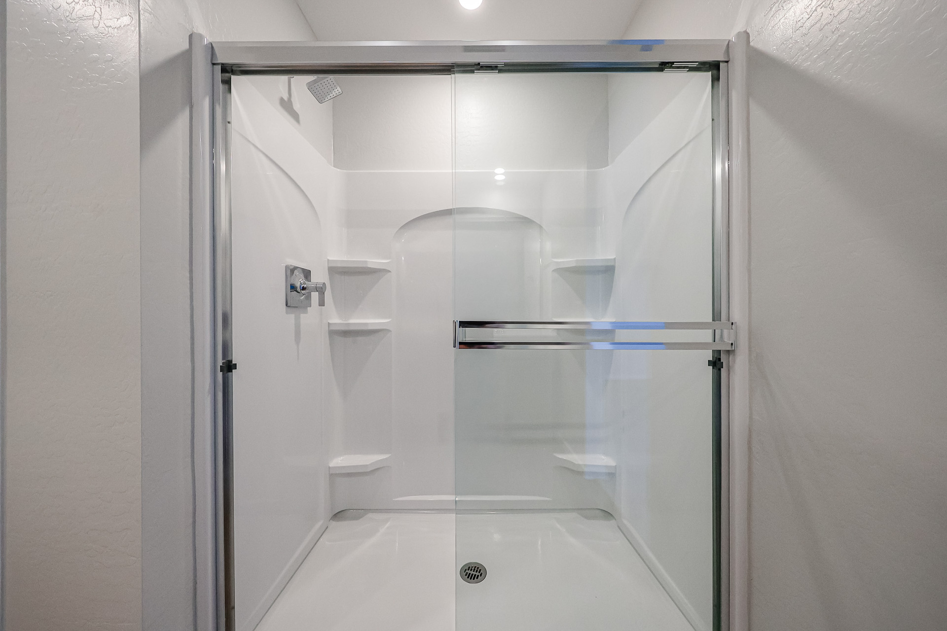 A shower unit in a bathroom.