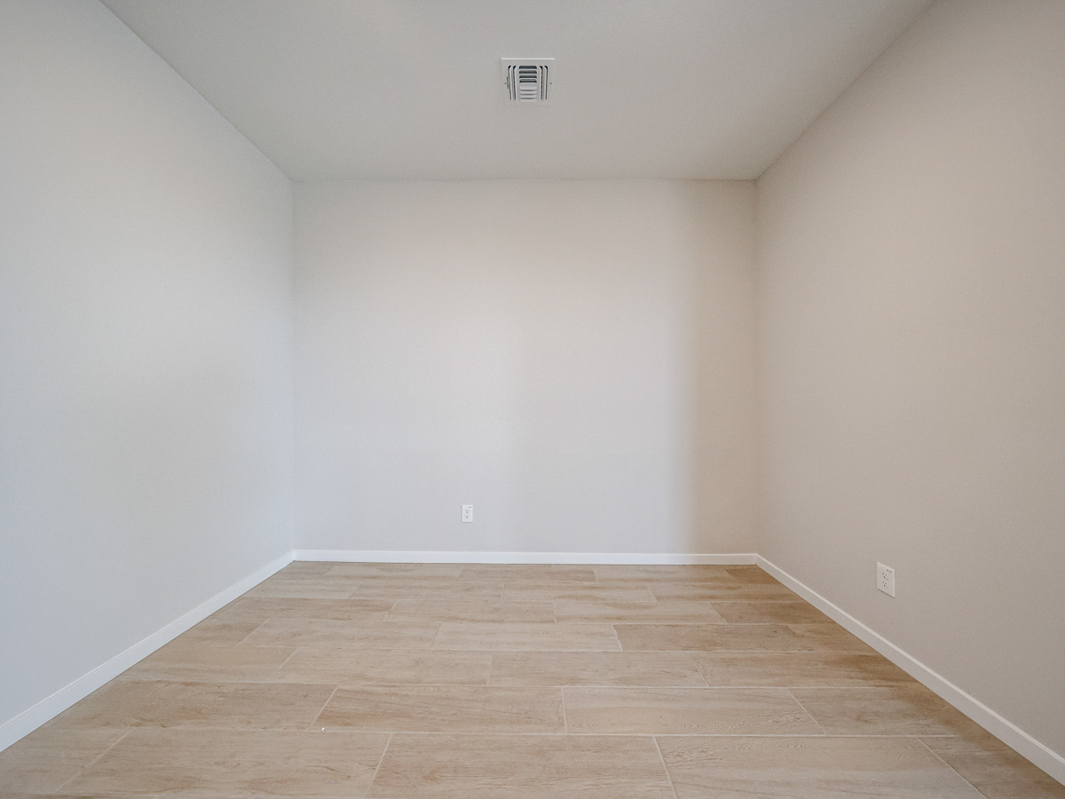 A room with a wood floor.