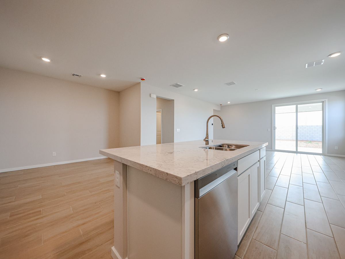 A kitchen with a marble countertop.